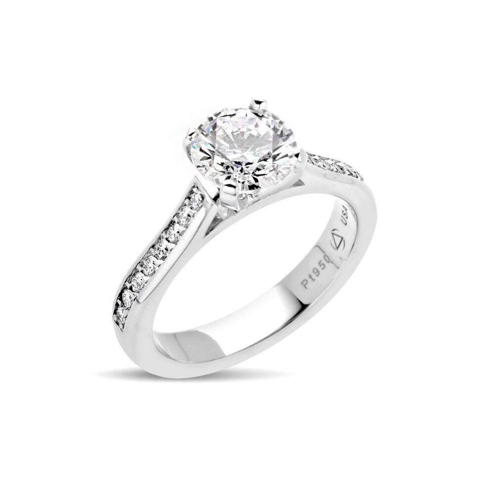In stock, U.S. size 5.75, in platinum, set with a 7mm Round CZ. With a Latin origin meaning "Of the heavens", our Celia ring accents the center stone with sweeping rows of diamonds. A modern take on the classic cathedral ring. Center Stone NOT included.<br> Celia Ring in Platinum Size 5.75