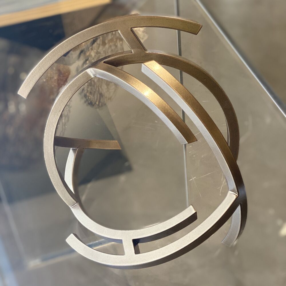 This visually magnificent sculpture by artist Miguel Edwards is made of steel with a powder coat. Moonrock explores underlying forms and concepts intrinsic in the dynamic between our sleeping and waking lives — as well as the visual logic of human perception. Moonrock