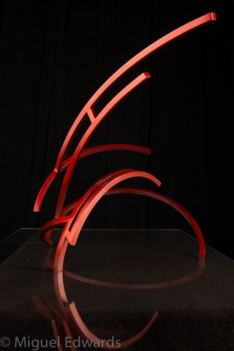 This stunning red sculpture by artist Miguel Edwards is made of steel with a powder coat. Ibis explores underlying forms and concepts intrinsic in the dynamic between our sleeping and waking lives — as well as the visual logic of human perception. Ibis