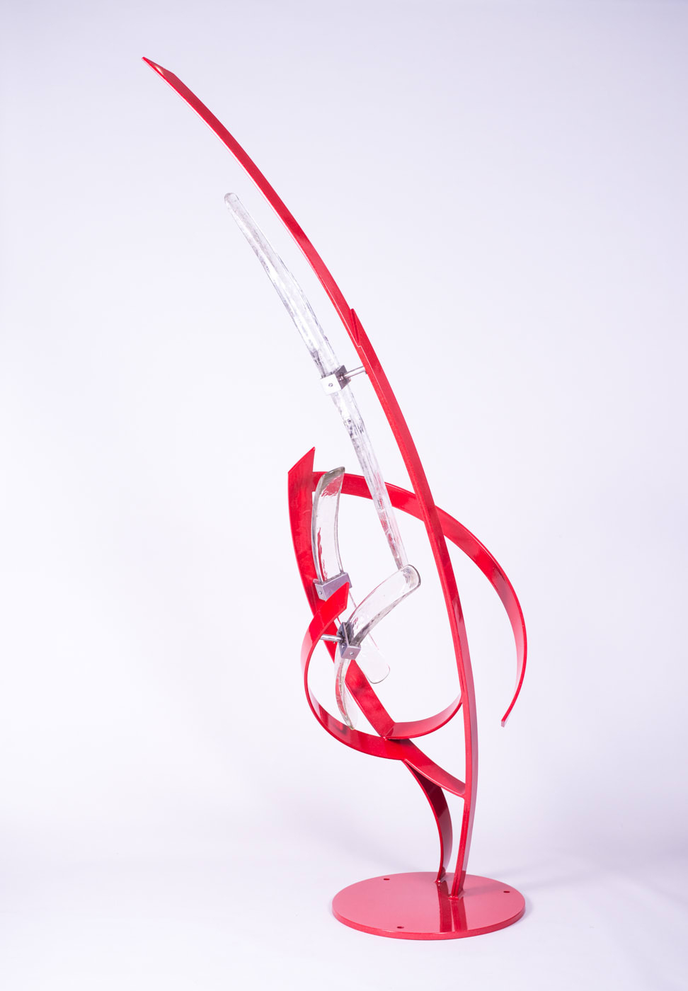 This alluring red sculpture with transparent elements by artist Miguel Edwards is made of steel and glass with a metal powder coat. Ascent explores underlying forms and concepts intrinsic in the dynamic between our sleeping and waking lives — as well as the visual logic of human perception. Ascent