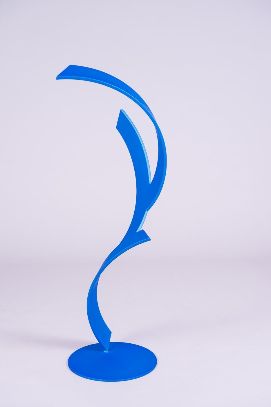 This beautiful blue sculpture by artist Miguel Edwards is made of steel with a powder coat. Quixotic explores underlying forms and concepts intrinsic in the dynamic between our sleeping and waking lives — as well as the visual logic of human perception. Quixotic