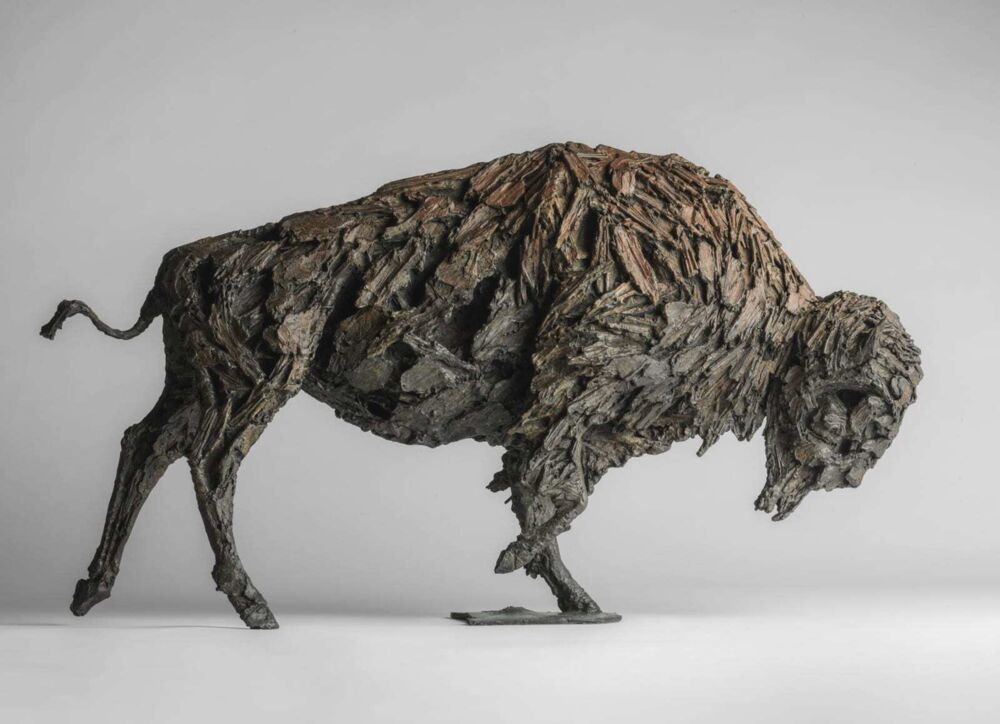 This bronze sculpture of an American bison by artist Joseph Paxton expresses the physical and psychological juxtapositions of strength, vulnerability, simplicity and complexity. Tatanka explores the connection between living beings and the environment. Tatanka