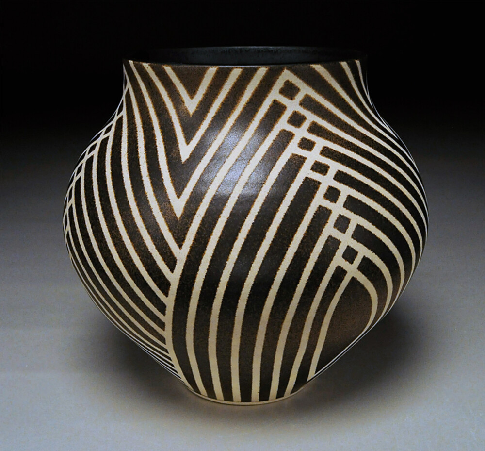 From the classic forms of antiquity to the simple, graceful pots made by indigenous peoples and the work of modern studio potters, the inspirations behind Nicholas Bernard’s mastery of the traditional vessel form are many. Dramatic color, subtle texture and graphic pattern accentuate Bronze Basket, bringing a visually striking aesthetic to any room or space. Bronze Basket