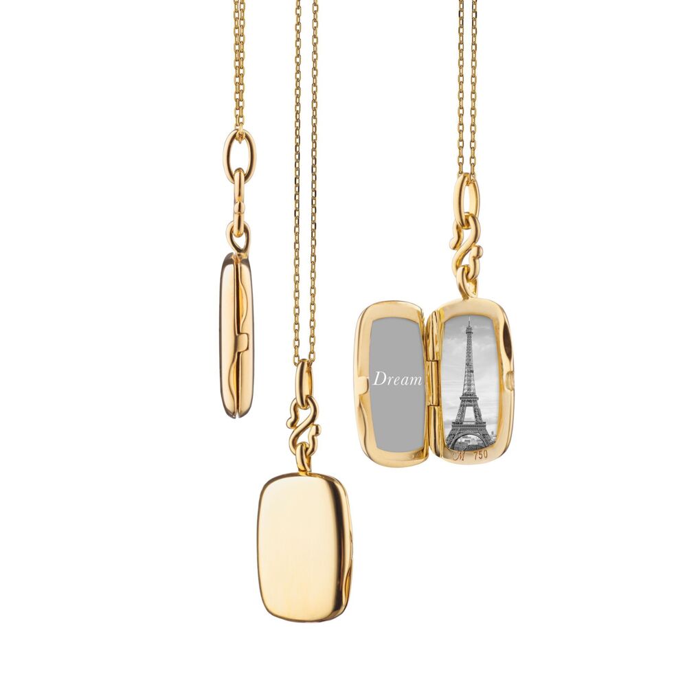 This resplendent 18K yellow gold slim rectangular locket brought to you by Monica Rich Kosann brings distinct beauty and elegance. It comes with a 17" delicate cable chain. Rectangular Locket