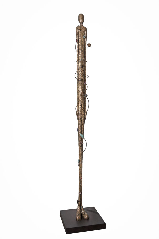 This freestanding bronze sculpture by artist Jennyfer Stratman explores the interconnectedness between nature and human form. Blossoming From Within speaks broadly of the human experience and our individual yet profoundly intertwined connections to something much greater than ourselves. Blossoming From Within