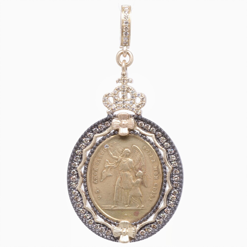 The front of this original French Guardian Angel medal translates to "Guardian Angel be my guide". The back translates to "Pray for us". Belief in guardian angels can be traced throughout all antiquity. This French medal represents your Guardian Angel that has been with you since you took your first breath and will be with you when you pass out of your body and return to the spiritual realms. This angel is unique to you and is there to guide you through your “spiritual journey” here on earth. She is a reminder of your faith in God and that you are never alone. The French medal is set in a Cynthia Ann 14k yellow gold 6.28g, champagne diamond 0.70 tcw, and rhodium sterling bezel. French Guardian Angel Pendant with St. Ignace