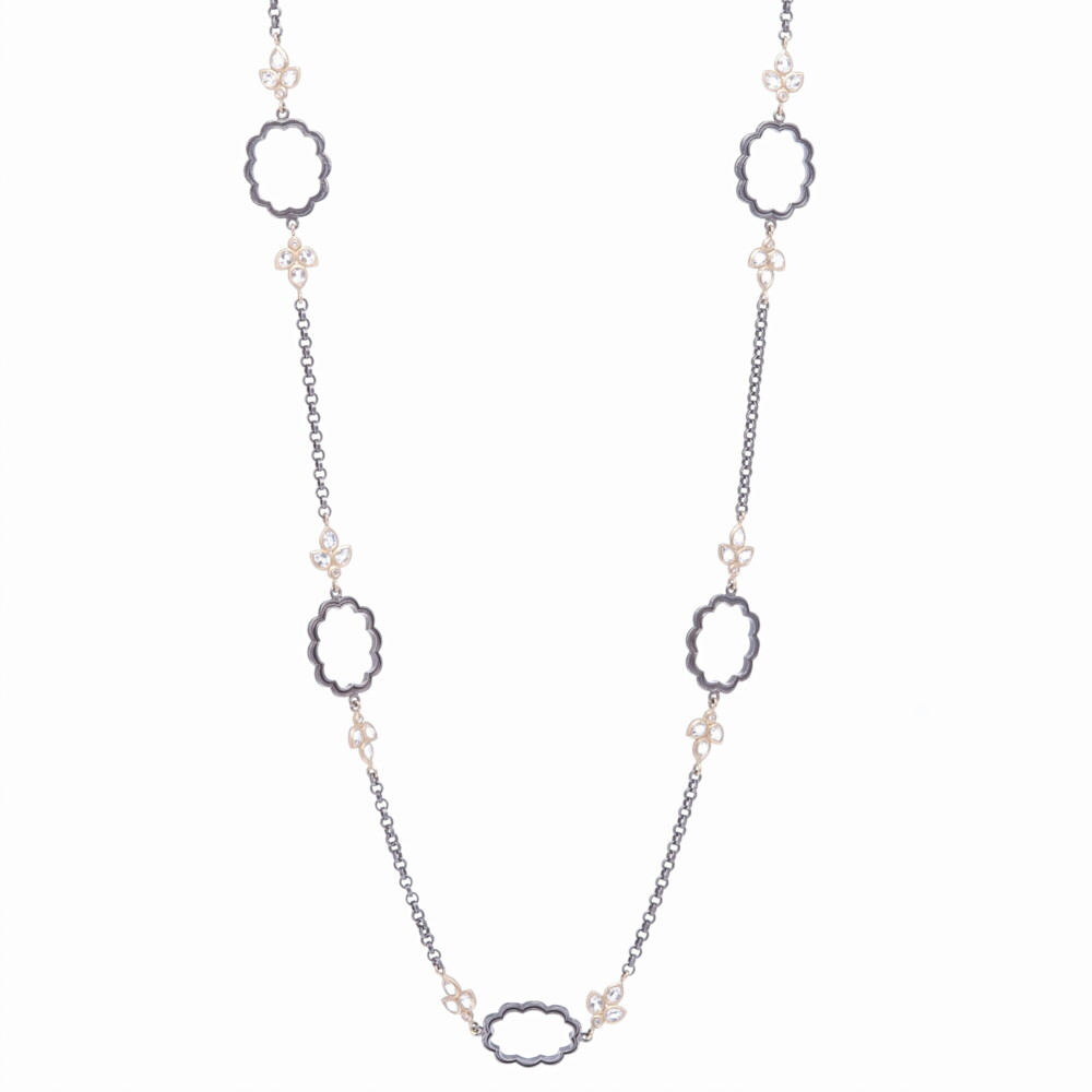 Handcrafted in rhodium sterling, this decorative floral chain makes quite the statement. The buds consist of three rose cut topaz and one diamond set in 14k yellow gold. Total gold weight 9.26g, White topaz 3.27ct, and Diamond 0.14ct. Scalloped Floral Leaf Chain
