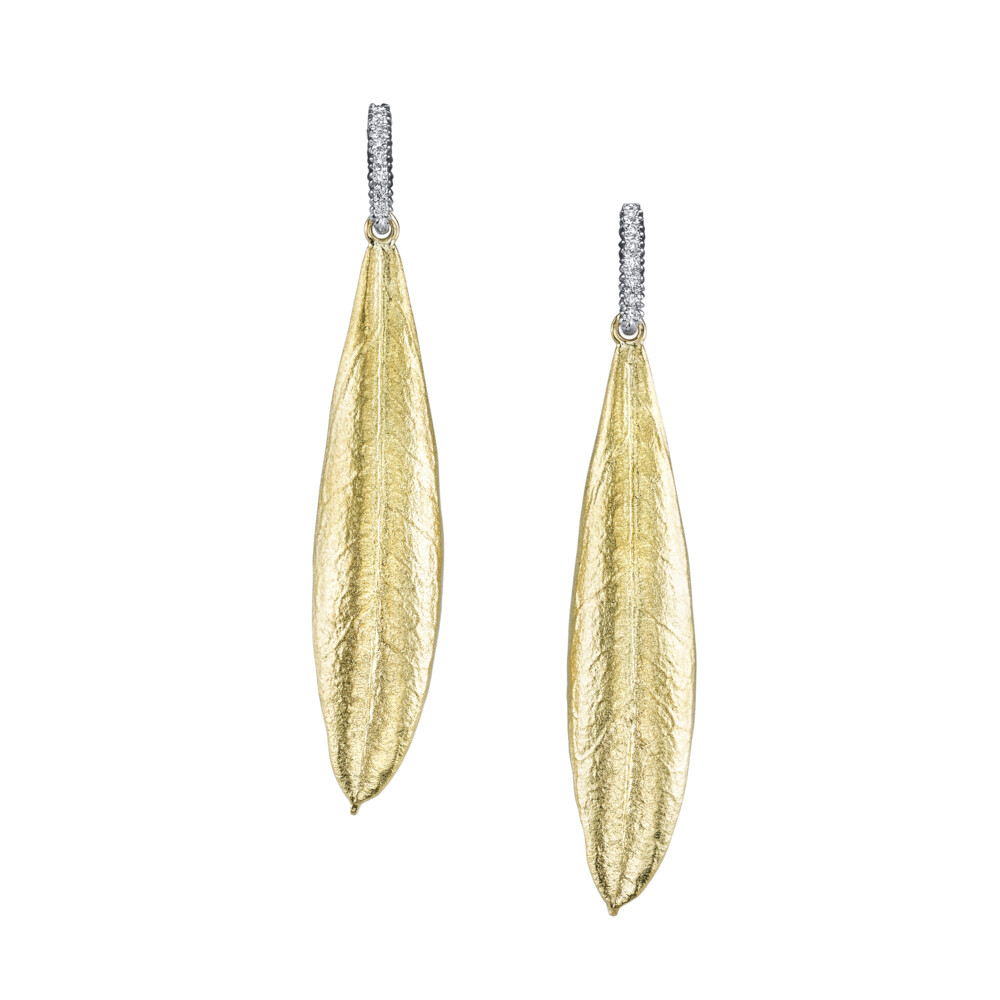 These gorgeous earrings brought to you by Aaron Henry Designs bring a refined elegance. They feature 18K white gold 0.07 carat diamond bar stems and a 19K yellow gold medium olive leaf design. Olive Leaf Earrings With Diamond Bar Stems