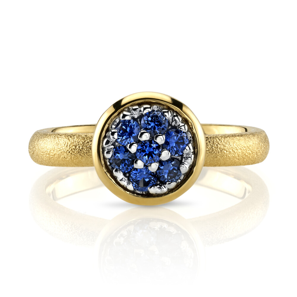 This jaw-dropping 18K yellow gold and 18K white gold ring brought to you by Aaron Henry Designs brings unrivaled beauty. It features a stunning 0.35 carat blue sapphire with aspen finish. Blue Sapphire Ring With Aspen Finish