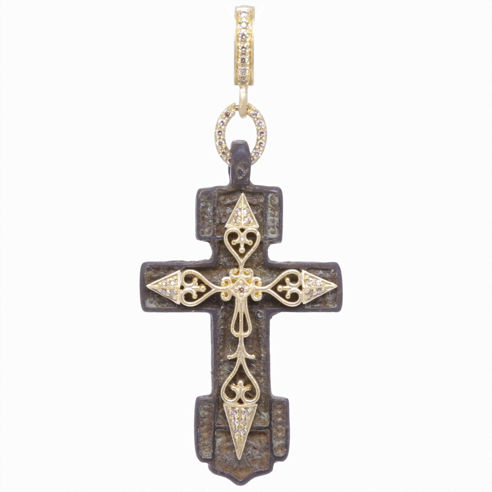This antique "Old Believers" Cross pendant is defined by its strait lines and delicate designs. The Old Believers were a Orthodox sect that broke away from the official Russian Orthodox Church as protest against church reforms; the schism took place in the 17th Century. This original antiquity is enhanced with a Cynthia Ann bezel handmade with 14k yellow gold 4.09g and champagne diamond 0.21 tcw. Old Believers Cross Pendant