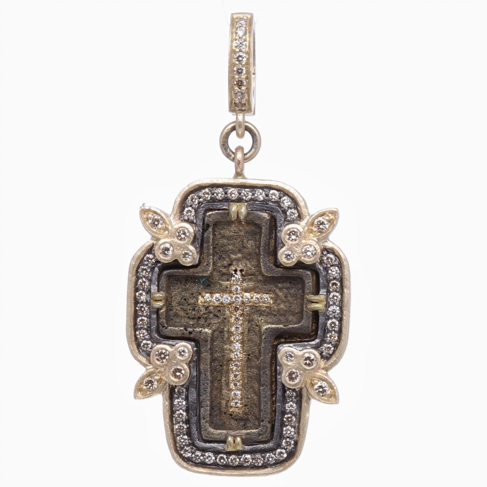 The Old Believers Cross is defined by it’s straight lines and no curves. The Orthodox “Old Believers” were an Orthodox sect that broke from the official Russian Orthodox Church as a protest against church reforms; the schism took place in the 17th century. This original Old Believers Crucifix was handcrafted using the "Lost Wax method". Cynthia Ann set this one of a kind antiquity in a 14k yellow gold 5.69g, diamond 0.62 tcw, and rhodium sterling bezel. The cross has a bale that opens up to 4mm. Small Old Believers Cross Pendant