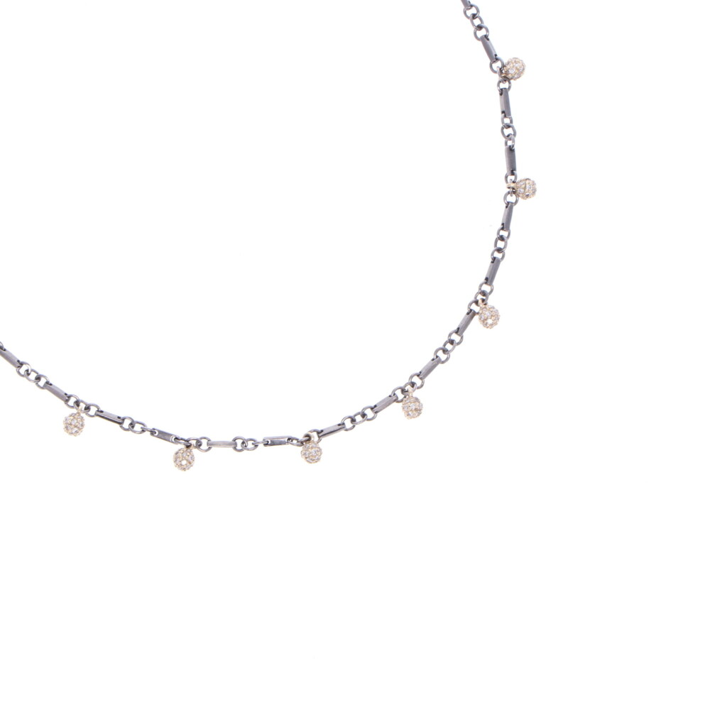 This polished handmade Rhodium Sterling chain with seven 14k Yellow Gold and Diamond spheres hangs at 17" or 18". There's 0.66 TCW Diamond, and 5.08g 14k Gold. Tri Colored Diamond Sphere Necklace 18"