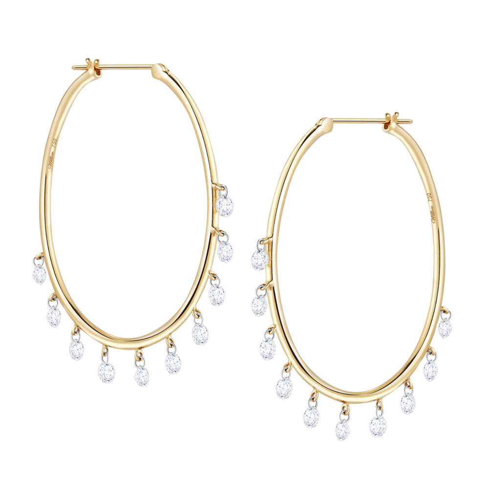 These eye-catching 18K yellow gold earrings brought to you by Willow Diamonds and designer Jacquie Earle bring true amazement. They feature 1.5" oval hoops and 10-round diamond dangles. Oh My Jazz Oval Hoops Diamond Earrings