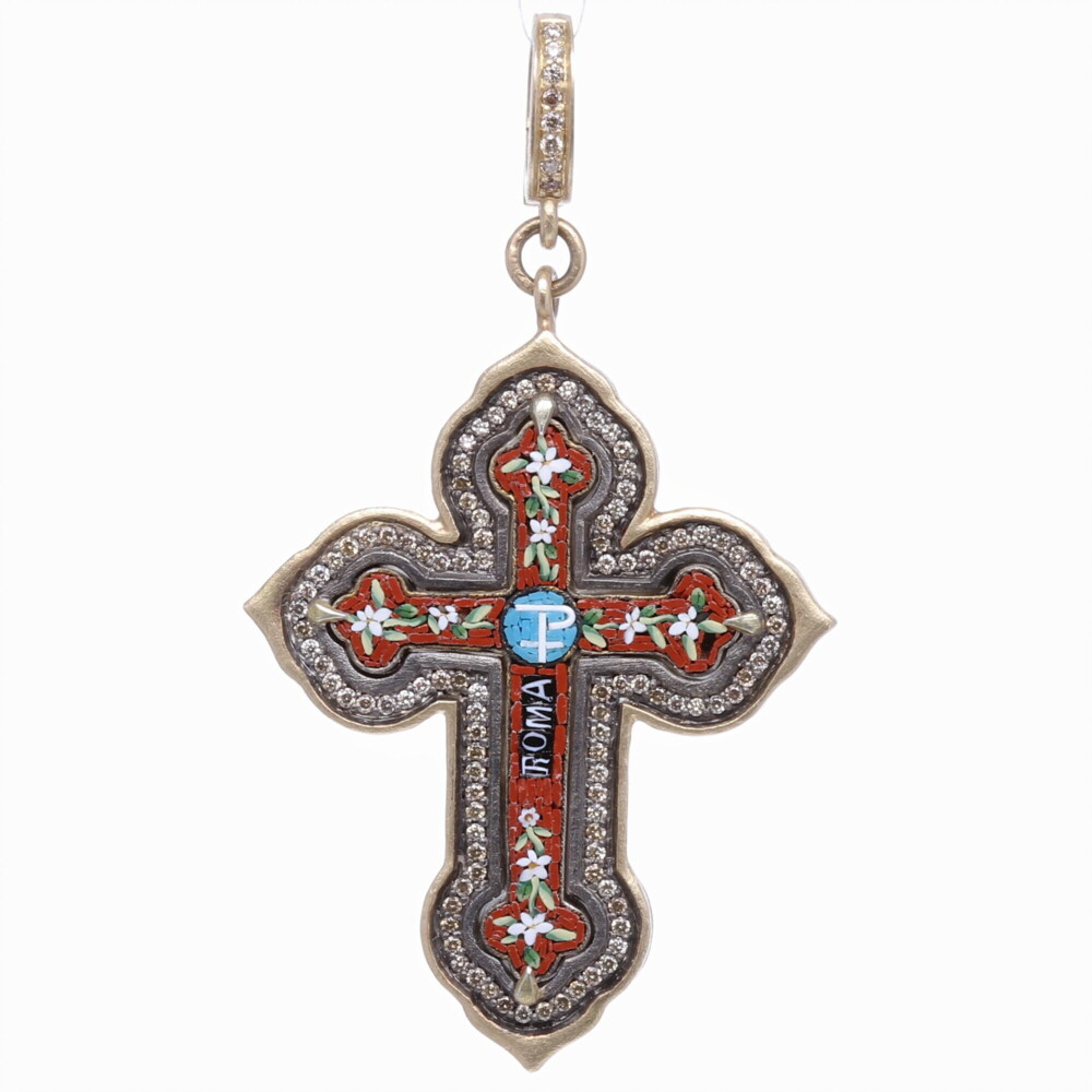 This is the smallest Grand Tour cross in our collection to date! The Grand Tour period in Europe was from 1680-1880. This is the time when students from all over the world began the travel to further enrich their classical studies. Most would start their journey in France and make their way to their final destination in Italy. Micro mosaics are small pictorial items consisting of hundreds of little tiles. Students during that period purchased their mosaic to capture memories that they wanted to bring back home. This original mosaic has maroon tiles surrounding the center Chi Rio cross. The one of a kind antiquity is set in a 14k gold 5.03g, champagne diamond 0.59 tcw, and rhodium sterling bezel. Italian Grand Tour Red Chi Rho Micro Mosaic Cross