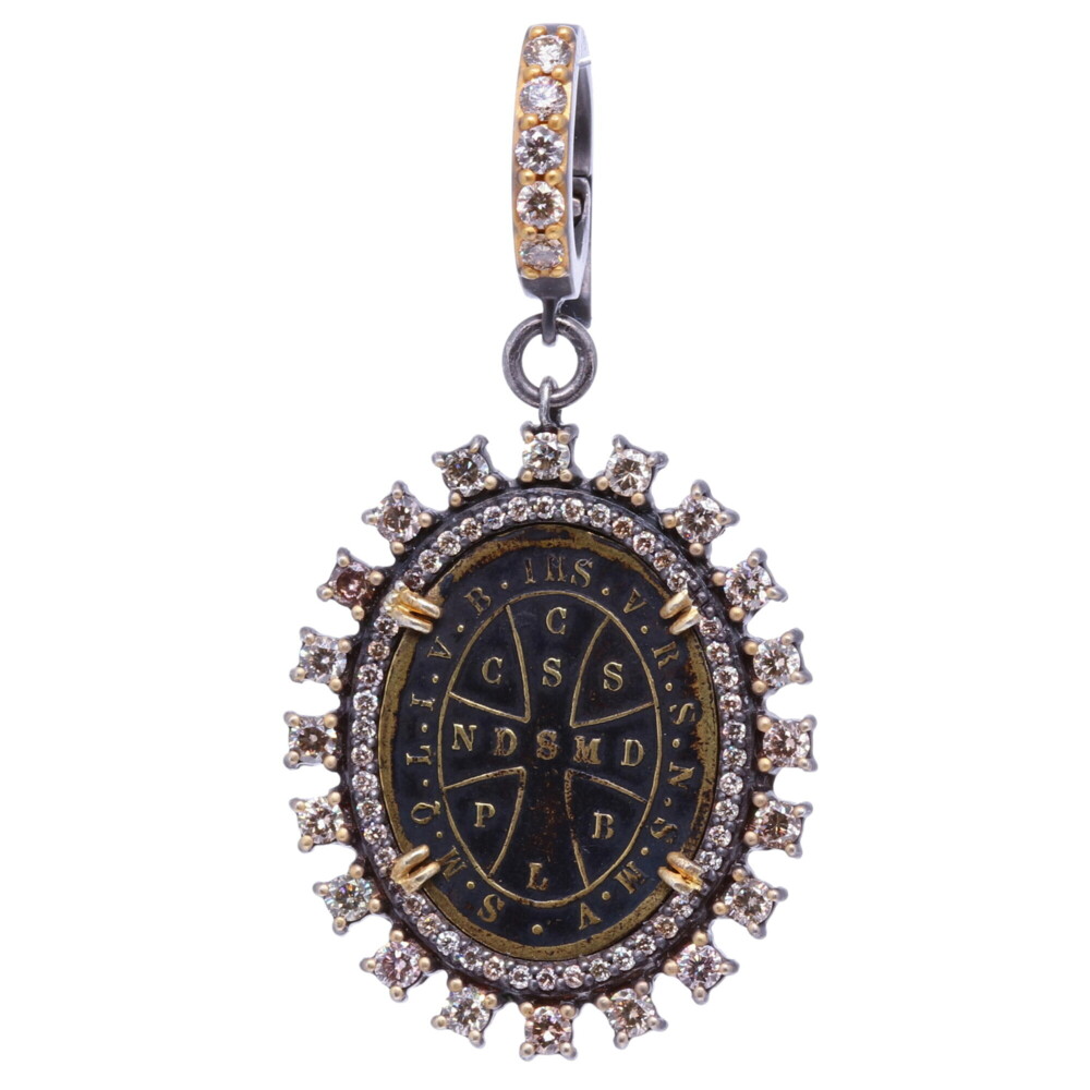 There is indeed no medal which possess such a wonderful power and protection from evil. On one side, the medal has a cross, the sign of our redemption, the protection shield given to us by God to ward off evil spirit. The monogram HIS (Jesus). The large CSPB on the front stands for "The Cross of our Holy Father Benedict". V R S N S M V - S M Q L I V B on the front translates to "Begone Satan! Never tempt me with your vanities! What you offer me is evil. Drink the poison yourself!" The back of the pendant St. Benedict is holding a cross in his right hand (his devotion) and his left hand is his rule for monasteries. This medal is set in a diamond 1.00 tcw, 14k Yellow Gold 2.34g and rhodium sterling bezel, with a 4mm bale opening allowing you to clip on any necklace. Antique St. Benedict Diamond Pendant