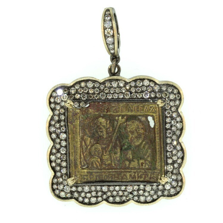 This remarkable 18th Century Russian Icon originally came from a three or four piece traveling bible. Traveling bibles were used for missionary work, military, or escaping the persecution from the authorities. During the 17th and 18th Century, master craftsman created these religious Icons by hand and sold them locally. This medal depicts Jesus, surrounded by divine light and supported by various Saints. The multicolored enamel is original. Chronicles and historical documents of the epoch give up hardly any information regarding the whereabouts of these work shops. 18th Century Russian Icon Bronze Pendant