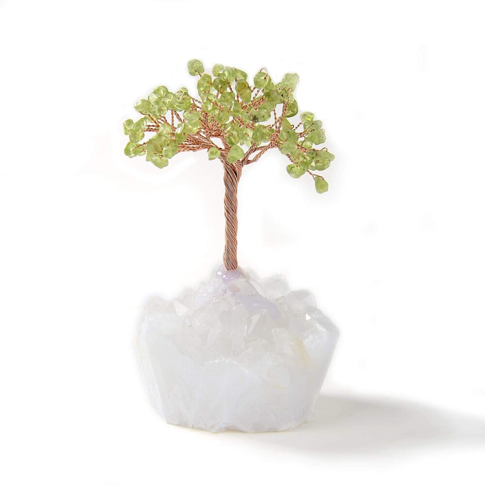 <font size="4"><span style="font-family: "EB Garamond";">Peridot Beaded Gemstone Tree On Quartz Crystal Base</span></font><div style="position: initial; margin: initial; font-family: "EB Garamond";"><font size="4"><br style="position: initial; margin: initial; font-family: "EB Garamond";"></font></div><div style="position: initial; margin: initial; font-family: "EB Garamond";"><p style="margin: initial; padding: 0px; border: 0px; font-variant-numeric: inherit; font-variant-east-asian: inherit; font-stretch: inherit; line-height: inherit; font-family: "EB Garamond"; vertical-align: baseline; color: rgb(51, 51, 51); position: initial;"><font size="4">All natural semi-precious gemstones estimated at 109 pieces.</font></p><p style="margin: initial; padding: 0px; border: 0px; font-variant-numeric: inherit; font-variant-east-asian: inherit; font-stretch: inherit; line-height: inherit; font-family: "EB Garamond"; vertical-align: baseline; color: rgb(51, 51, 51); position: initial;"><font size="4">Featured on this tree is natural Peridot. It is believed to:</font></p><ul style="margin: initial; padding: 0px; border: 0px; font-variant-numeric: inherit; font-variant-east-asian: inherit; font-stretch: inherit; line-height: inherit; font-family: "EB Garamond"; vertical-align: baseline; color: rgb(51, 51, 51); position: initial;"><li style="margin: initial; padding: 0px; border: 0px; font-style: inherit; font-variant: inherit; font-weight: inherit; font-stretch: inherit; line-height: inherit; font-family: "EB Garamond"; vertical-align: baseline; list-style: outside disc; position: initial;"><font size="4">Alleviate jealousy, resentment, spite, bitterness, hatred and greed.</font></li><li style="margin: initial; padding: 0px; border: 0px; font-style: inherit; font-variant: inherit; font-weight: inherit; font-stretch: inherit; line-height: inherit; font-family: "EB Garamond"; vertical-align: baseline; list-style: outside disc; position: initial;"><font size="4">Reduce stress, anger and guilt.</font></li><li style="margin: initial; padding: 0px; border: 0px; font-style: inherit; font-variant: inherit; font-weight: inherit; font-stretch: inherit; line-height: inherit; font-family: "EB Garamond"; vertical-align: baseline; list-style: outside disc; position: initial;"><font size="4">Open our hearts to joy and new relationships.</font></li><li style="margin: initial; padding: 0px; border: 0px; font-style: inherit; font-variant: inherit; font-weight: inherit; font-stretch: inherit; line-height: inherit; font-family: "EB Garamond"; vertical-align: baseline; list-style: outside disc; position: initial;"><font size="4">Enhance confidence and assertion.</font></li><li style="margin: initial; padding: 0px; border: 0px; font-style: inherit; font-variant: inherit; font-weight: inherit; font-stretch: inherit; line-height: inherit; font-family: "EB Garamond"; vertical-align: baseline; list-style: outside disc; position: initial;"><font size="4">Motivates growth and change.</font></li></ul><p style="margin: initial; padding: 0px; border: 0px; font-variant-numeric: inherit; font-variant-east-asian: inherit; font-stretch: inherit; line-height: inherit; font-family: "EB Garamond"; vertical-align: baseline; color: rgb(51, 51, 51); position: initial;"><font size="4">This beautiful tree rests on a natural Brazilian Quartz base. Clear Quartz is believed to:</font></p><ul style="margin: initial; padding: 0px; border: 0px; font-variant-numeric: inherit; font-variant-east-asian: inherit; font-stretch: inherit; line-height: inherit; font-family: "EB Garamond"; vertical-align: baseline; color: rgb(51, 51, 51); position: initial;"><li style="margin: initial; padding: 0px; border: 0px; font-style: inherit; font-variant: inherit; font-weight: inherit; font-stretch: inherit; line-height: inherit; font-family: "EB Garamond"; vertical-align: baseline; list-style: outside disc; position: initial;"><font size="4">Bring peace.</font></li><li style="margin: initial; padding: 0px; border: 0px; font-style: inherit; font-variant: inherit; font-weight: inherit; font-stretch: inherit; line-height: inherit; font-family: "EB Garamond"; vertical-align: baseline; list-style: outside disc; position: initial;"><font size="4">Alleviate stress and anxiety.</font></li><li style="margin: initial; padding: 0px; border: 0px; font-style: inherit; font-variant: inherit; font-weight: inherit; font-stretch: inherit; line-height: inherit; font-family: "EB Garamond"; vertical-align: baseline; list-style: outside disc; position: initial;"><font size="4">Amplify your energy and intentions.</font></li></ul><p style="margin: initial; padding: 0px; border: 0px; font-variant-numeric: inherit; font-variant-east-asian: inherit; font-stretch: inherit; line-height: inherit; font-family: "EB Garamond"; vertical-align: baseline; color: rgb(51, 51, 51); position: initial;"><font size="4">Measures at 4 inches tall.</font></p><p style="margin: initial; padding: 0px; border: 0px; font-variant-numeric: inherit; font-variant-east-asian: inherit; font-stretch: inherit; line-height: inherit; font-family: "EB Garamond"; vertical-align: baseline; color: rgb(51, 51, 51); position: initial;"><font size="4">As this is an original, hand-made gemstone tree, please allow for slight variations in the size and color of the gemstones shown.</font></p></div> Peridot Beaded Gemstone Tree On Quartz Crystal Base