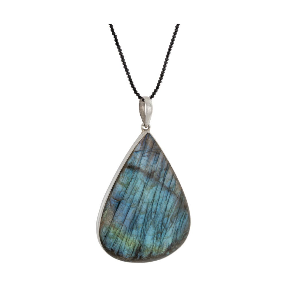 <font size="4"><span style="font-family: "EB Garamond";"><font size="4">Labradorite Pendant -Simple Pear Cabochon With Blue-green Shift 3"+</font></span></font><div style="position: initial; margin: initial; font-family: "EB Garamond";"><font size="4"><span style="font-family: "EB Garamond"; position: initial; margin: initial;"><span style="font-family: "EB Garamond";"><font size="4">*Chains are sold separately</font></span></span><br style="position: initial; margin: initial; font-family: "EB Garamond";"></font></div><div style="position: initial; margin: initial; font-family: "EB Garamond";"><font size="4"><span style="font-family: "EB Garamond"; position: initial; margin: initial;"> </span><br style="position: initial; margin: initial; font-family: "EB Garamond";"></font></div><div style="position: initial; margin: initial; font-family: "EB Garamond";"><p style="margin: initial; font-variant-numeric: normal; font-variant-east-asian: normal; font-stretch: normal; line-height: normal; font-family: "EB Garamond"; color: rgb(0, 0, 0); position: initial;"><font size="4">“Gem of Voice”</font></p><p style="margin: initial; font-variant-numeric: normal; font-variant-east-asian: normal; font-stretch: normal; line-height: normal; font-family: "EB Garamond"; color: rgb(0, 0, 0); position: initial;"><font size="4"><span style="position: initial; margin: initial; font-family: "EB Garamond";">Labradorite </span>is a form of feldspar with striated tabular crystallization</font></p><p style="margin: initial; font-variant-numeric: normal; font-variant-east-asian: normal; font-stretch: normal; line-height: normal; font-family: "EB Garamond"; color: rgb(0, 0, 0); position: initial;"><font size="4">patterns. Meaning that with the perfect angle of light hitting the fine</font></p><p style="margin: initial; font-variant-numeric: normal; font-variant-east-asian: normal; font-stretch: normal; line-height: normal; font-family: "EB Garamond"; color: rgb(0, 0, 0); position: initial;"><font size="4">layers, an exhilarating feeling can be achieved by the iridescent</font></p><p style="margin: initial; font-variant-numeric: normal; font-variant-east-asian: normal; font-stretch: normal; line-height: normal; font-family: "EB Garamond"; color: rgb(0, 0, 0); position: initial;"><font size="4">reflections that naturally lie within this mysterious stone. Find yours!</font></p><p style="margin: initial; font-variant-numeric: normal; font-variant-east-asian: normal; font-stretch: normal; line-height: normal; font-family: "EB Garamond"; color: rgb(0, 0, 0); position: initial;"><font size="4">With Labradorite’s iridescent and sometimes rainbow-like flashes of</font></p><p style="margin: initial; font-variant-numeric: normal; font-variant-east-asian: normal; font-stretch: normal; line-height: normal; font-family: "EB Garamond"; color: rgb(0, 0, 0); position: initial;"><font size="4">color, it can be very beneficial in uniting all the chakras. While lighter</font></p><p style="margin: initial; font-variant-numeric: normal; font-variant-east-asian: normal; font-stretch: normal; line-height: normal; font-family: "EB Garamond"; color: rgb(0, 0, 0); position: initial;"><font size="4">shades of blue carry the power of flexibility, relaxation, and balance;</font></p><p style="font-variant-numeric: normal; font-variant-east-asian: normal; font-stretch: normal; line-height: normal; font-family: "EB Garamond"; color: rgb(0, 0, 0); position: initial; margin: initial;"><font size="4">darker shades encourage the power of truth. Mined in Madagascar.</font></p></div> Labradorite Pendant -Simple Pear Cabochon With Blue-green Shift 3"+