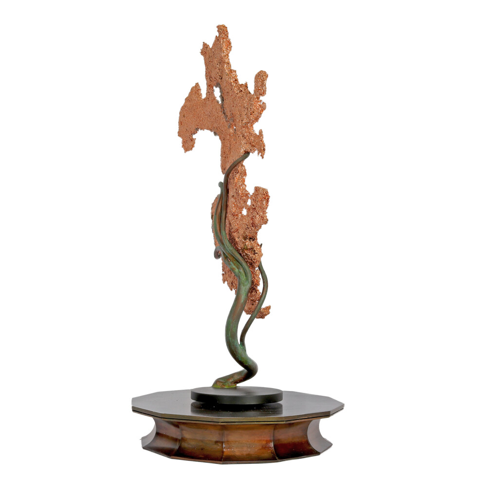 <span style="position: initial; margin: initial;"></span><span style="font-family: "EB Garamond"; position: initial; margin: initial;"><font size="4">Michigan Native Copper Specimen On Custom Rotating Vine Stand -Flat.</font></span><div style="position: initial; margin: initial;"><div style="font-size: 16.8px; position: initial; margin: initial;"><p style="margin: initial; line-height: normal; color: rgb(0, 0, 0); font-variant-numeric: normal; font-variant-east-asian: normal; font-stretch: normal; font-family: "EB Garamond"; position: initial;"><span style="position: initial; margin: initial;"><font style="font-size: 1.2rem; line-height: 22px; position: initial; margin: initial;">Native Copper </font></span><span style="font-size: 1.2rem; position: initial; margin: initial;">is used to form these interesting sculptures. Molten copper at</span></p><p style="margin: initial; line-height: normal; color: rgb(0, 0, 0); font-variant-numeric: normal; font-variant-east-asian: normal; font-stretch: normal; font-family: "EB Garamond"; position: initial;"><font style="font-size: 1.2rem; line-height: 22px; position: initial; margin: initial;">2200 degrees Fahrenheit is poured into a water-soaked straw. The straw forms</font></p><p style="margin: initial; line-height: normal; color: rgb(0, 0, 0); font-variant-numeric: normal; font-variant-east-asian: normal; font-stretch: normal; font-family: "EB Garamond"; position: initial;"><font style="font-size: 1.2rem; line-height: 22px; position: initial; margin: initial;">the shape then burns away, and the copper forms solidify in the cool water.</font></p><p style="margin: initial; line-height: normal; color: rgb(0, 0, 0); font-variant-numeric: normal; font-variant-east-asian: normal; font-stretch: normal; font-family: "EB Garamond"; position: initial;"><font style="font-size: 1.2rem; line-height: 22px; position: initial; margin: initial;">Old customs of the early miners indicate that lead was used in the above</font></p><p style="margin: initial; line-height: normal; color: rgb(0, 0, 0); font-variant-numeric: normal; font-variant-east-asian: normal; font-stretch: normal; font-family: "EB Garamond"; position: initial;"><font style="font-size: 1.2rem; line-height: 22px; position: initial; margin: initial;">process. Fortune telling was a New Year’s Day pastime; good or bad luck was</font></p><p style="margin: initial; line-height: normal; color: rgb(0, 0, 0); font-variant-numeric: normal; font-variant-east-asian: normal; font-stretch: normal; font-family: "EB Garamond"; position: initial;"><font style="font-size: 1.2rem; line-height: 22px; position: initial; margin: initial;">determined by the shape and size of the sculpture. Following the old</font></p><p style="margin: initial; line-height: normal; color: rgb(0, 0, 0); font-variant-numeric: normal; font-variant-east-asian: normal; font-stretch: normal; font-family: "EB Garamond"; position: initial;"><font style="font-size: 1.2rem; line-height: 22px; position: initial; margin: initial;">traditions, this sculptured copper has been proudly manufactured in</font></p><p style="margin: initial; line-height: normal; color: rgb(0, 0, 0); font-variant-numeric: normal; font-variant-east-asian: normal; font-stretch: normal; font-family: "EB Garamond"; position: initial;"><font style="font-size: 1.2rem; line-height: 22px; position: initial; margin: initial;">Michigan’s Keweenaw Peninsula. An amazing work of art.</font></p></div></div> Michigan Native Copper Specimen On Custom Rotating Vine Stand -Flat