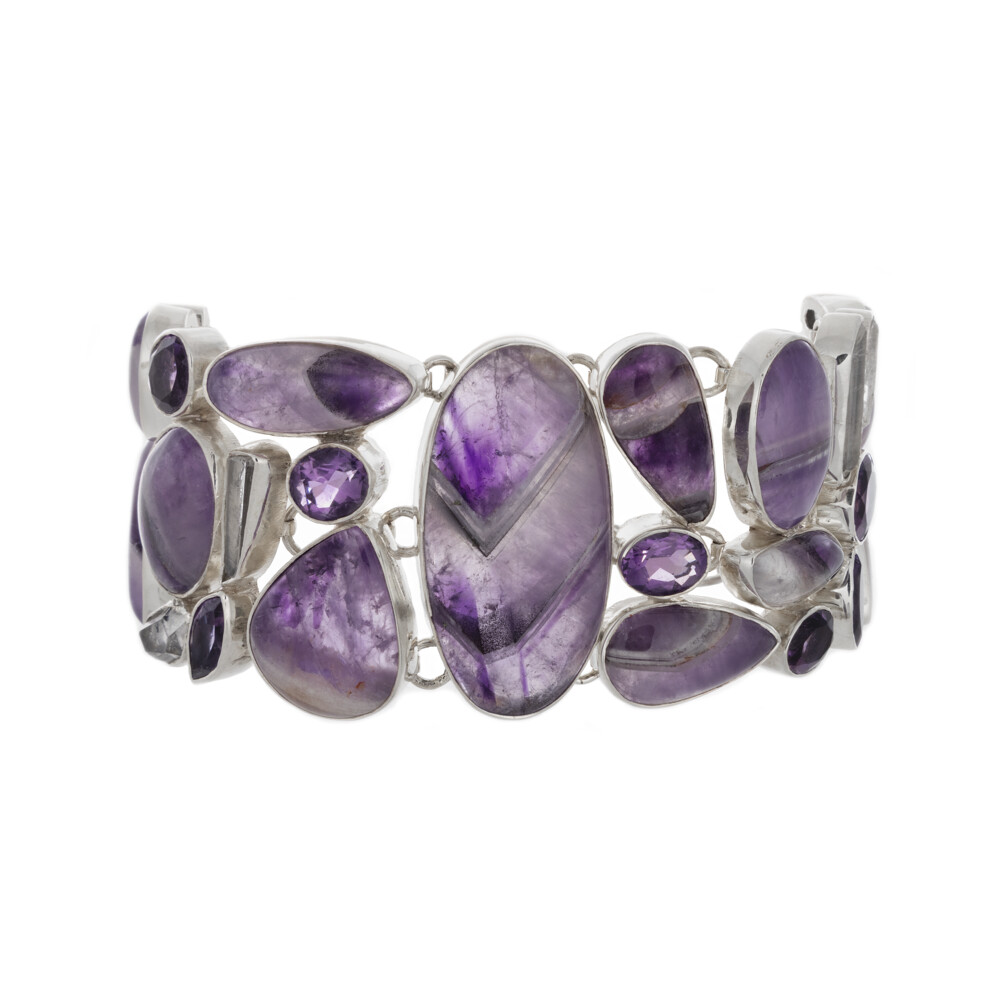 <font size="4"><span style="font-family: "EB Garamond";"><font size="4" style="">Chevron Amethyst Bracelet With Amethyst & Quartz & Herkimer Diamonds</font></span></font><div style="position: initial; margin: initial; font-family: "EB Garamond";"><font size="4"><span style="color: rgb(0, 0, 0); font-family: "EB Garamond";"><br></span></font></div><div style="position: initial; margin: initial; font-family: "EB Garamond";"><font size="4"><span style="color: rgb(0, 0, 0); font-family: "EB Garamond";">“Gem of Self-Discovery”</span><br style="font-family: "EB Garamond";"></font></div><div style="position: initial; margin: initial; font-family: "EB Garamond";"><p style="margin: initial; font-variant-numeric: normal; font-variant-east-asian: normal; font-stretch: normal; line-height: normal; font-family: "EB Garamond"; color: rgb(0, 0, 0); position: initial;"><font size="4"><span style="position: initial; margin: initial; font-family: "EB Garamond";">Chevron Amethyst </span>also called</font></p><p style="margin: initial; font-variant-numeric: normal; font-variant-east-asian: normal; font-stretch: normal; line-height: normal; font-family: "EB Garamond"; color: rgb(0, 0, 0); position: initial;"><font size="4"><span style="position: initial; margin: initial; font-family: "EB Garamond";">Lace Amethyst </span>is comprised of bands</font></p><p style="margin: initial; font-variant-numeric: normal; font-variant-east-asian: normal; font-stretch: normal; line-height: normal; font-family: "EB Garamond"; color: rgb(0, 0, 0); position: initial;"><font size="4">of amethyst between layers of white quartz creating a pattern of</font></p><p style="margin: initial; font-variant-numeric: normal; font-variant-east-asian: normal; font-stretch: normal; line-height: normal; font-family: "EB Garamond"; color: rgb(0, 0, 0); position: initial;"><font size="4">chevron and diamond patterns. The Amethyst’s purple color is derived</font></p><p style="margin: initial; font-variant-numeric: normal; font-variant-east-asian: normal; font-stretch: normal; line-height: normal; font-family: "EB Garamond"; color: rgb(0, 0, 0); position: initial;"><font size="4">mainly from magnesium sulfur, along with other trace minerals.</font></p><div style="position: initial; margin: initial; font-family: "EB Garamond";"><font size="4"><br style="position: initial; margin: initial; font-family: "EB Garamond";"></font></div><div style="position: initial; margin: initial; font-family: "EB Garamond";"><p style="margin: initial; font-variant-numeric: normal; font-variant-east-asian: normal; font-stretch: normal; line-height: normal; font-family: "EB Garamond"; color: rgb(0, 0, 0); position: initial;"><font size="4">Gem of Embodying Pure Energy”</font></p><p style="margin: initial; font-variant-numeric: normal; font-variant-east-asian: normal; font-stretch: normal; line-height: normal; font-family: "EB Garamond"; color: rgb(0, 0, 0); position: initial;"><span style="position: initial; margin: initial; font-family: "EB Garamond";"><font size="4">Herkimer Diamond</font></span><span style="font-size: 1.2rem;">, named as double terminated quartz crystals</span></p><p style="margin: initial; font-variant-numeric: normal; font-variant-east-asian: normal; font-stretch: normal; line-height: normal; font-family: "EB Garamond"; color: rgb(0, 0, 0); position: initial;"><font size="4">discovered in and around the Herkimer & Mohawk Counties in New York.</font></p><p style="margin: initial; font-variant-numeric: normal; font-variant-east-asian: normal; font-stretch: normal; line-height: normal; font-family: "EB Garamond"; color: rgb(0, 0, 0); position: initial;"><font size="4">Possessing 18 facets, six sides and two terminations, it’s harder than other</font></p><p style="margin: initial; font-variant-numeric: normal; font-variant-east-asian: normal; font-stretch: normal; line-height: normal; font-family: "EB Garamond"; color: rgb(0, 0, 0); position: initial;"><font size="4">forms of quartz. These ‘Diamonds’ are amplifiers that boost the power of</font></p><p style="margin: initial; font-variant-numeric: normal; font-variant-east-asian: normal; font-stretch: normal; line-height: normal; font-family: "EB Garamond"; color: rgb(0, 0, 0); position: initial;"><font size="4">other stones. It’s a supreme remedy for fighting pain, a powerful purifier in</font></p><p style="margin: initial; font-variant-numeric: normal; font-variant-east-asian: normal; font-stretch: normal; line-height: normal; font-family: "EB Garamond"; color: rgb(0, 0, 0); position: initial;"><font size="4">ridding the body of toxins; stimulates the immune system, and conscious</font></p><p style="margin: initial; font-variant-numeric: normal; font-variant-east-asian: normal; font-stretch: normal; line-height: normal; font-family: "EB Garamond"; color: rgb(0, 0, 0); position: initial;"><font size="4">attunement to the highest level.</font></p></div></div> Chevron Amethyst Bracelet With Amethyst & Quartz & Herkimer Diamonds