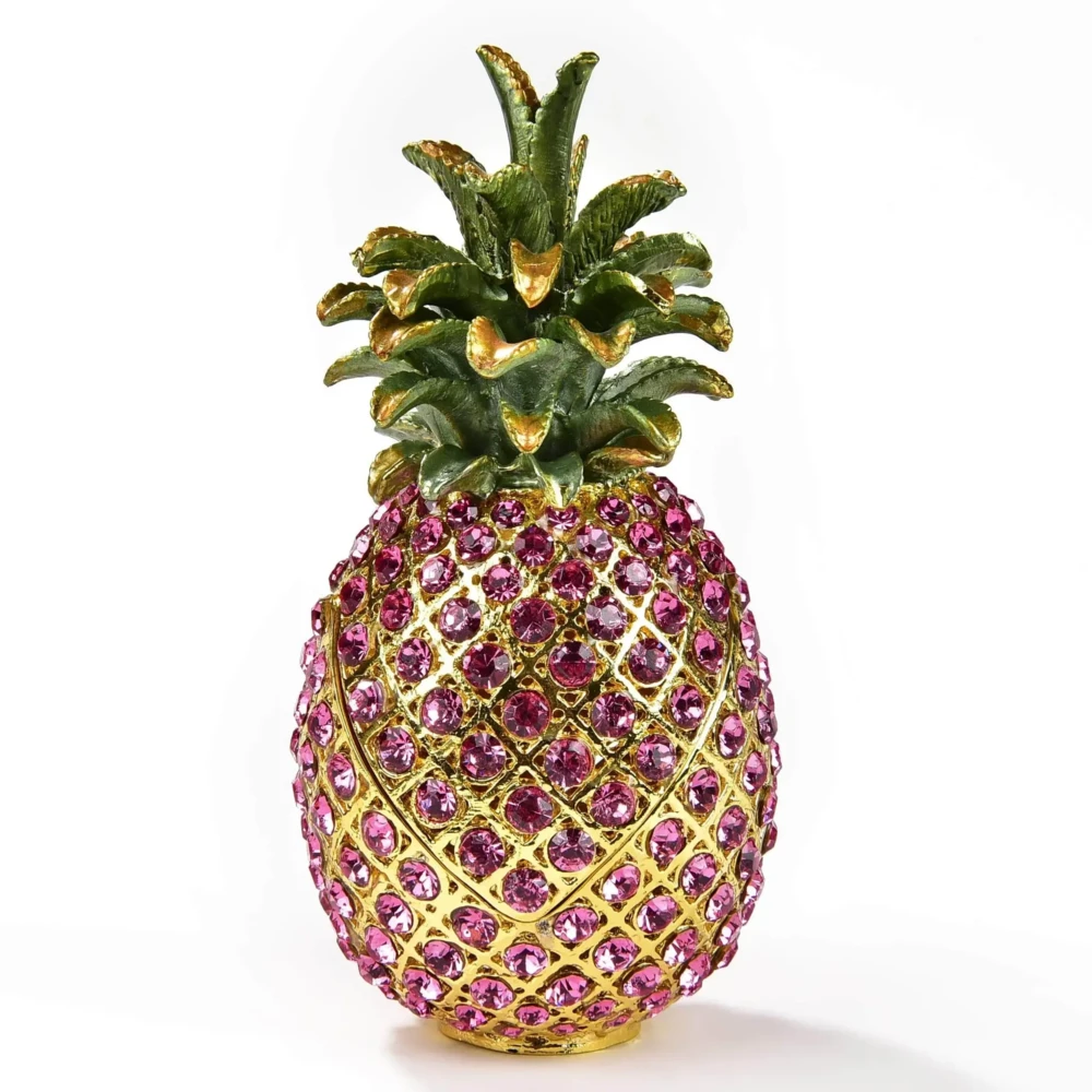 <font size="4"><span style="font-family: "EB Garamond";">Pink Pineapple Figurine Jewel Box</span></font><div style="position: initial; margin: initial; font-family: "EB Garamond";"><font size="4"><br style="position: initial; margin: initial; font-family: "EB Garamond";"></font></div><div style="position: initial; margin: initial; font-family: "EB Garamond";"><p style="margin: initial; padding: 0px; border: 0px; font-family: "EB Garamond"; font-stretch: inherit; line-height: inherit; vertical-align: baseline; caret-color: rgb(51, 51, 51); color: rgb(51, 51, 51); text-size-adjust: auto; position: initial;"><font size="4">Enjoy this original, jeweled figurine box made with sparkling crystals.<br style="position: initial; margin: initial; font-family: "EB Garamond";"><br style="position: initial; margin: initial; font-family: "EB Garamond";">This trinket box is glazed with pearlized enamel and is perfect for displaying on your desk, vanity, bedroom, and office. The hand-set crystals bring out a special sparkle to wherever it is displayed.</font></p><p style="margin: initial; padding: 0px; border: 0px; font-family: "EB Garamond"; font-stretch: inherit; line-height: inherit; vertical-align: baseline; caret-color: rgb(51, 51, 51); color: rgb(51, 51, 51); text-size-adjust: auto; position: initial;"><font size="4"><br style="position: initial; margin: initial; font-family: "EB Garamond";">You will find a hidden hinge that opens up a secret compartment for your treasured jewelry, stones, and prized possessions.<br style="position: initial; margin: initial; font-family: "EB Garamond";"><br></font></p><p style="margin: initial; padding: 0px; border: 0px; font-family: "EB Garamond"; font-stretch: inherit; line-height: inherit; vertical-align: baseline; caret-color: rgb(51, 51, 51); color: rgb(51, 51, 51); text-size-adjust: auto; position: initial;"><font size="4">Height: 5 in.</font></p><p style="margin: initial; padding: 0px; border: 0px; font-family: "EB Garamond"; font-stretch: inherit; line-height: inherit; vertical-align: baseline; caret-color: rgb(51, 51, 51); color: rgb(51, 51, 51); text-size-adjust: auto; position: initial;"><font size="4">Length: 2.5 in.</font></p><p style="margin: initial; padding: 0px; border: 0px; font-family: "EB Garamond"; font-stretch: inherit; line-height: inherit; vertical-align: baseline; caret-color: rgb(51, 51, 51); color: rgb(51, 51, 51); text-size-adjust: auto; position: initial;"><font size="4">Width: 2.5 in.</font></p><p style="margin: initial; padding: 0px; border: 0px; font-family: "EB Garamond"; font-stretch: inherit; line-height: inherit; vertical-align: baseline; caret-color: rgb(51, 51, 51); color: rgb(51, 51, 51); text-size-adjust: auto; position: initial;"><font size="4">Weight: 285 grams.</font></p></div> Pink Pineapple Figurine Jewel Box