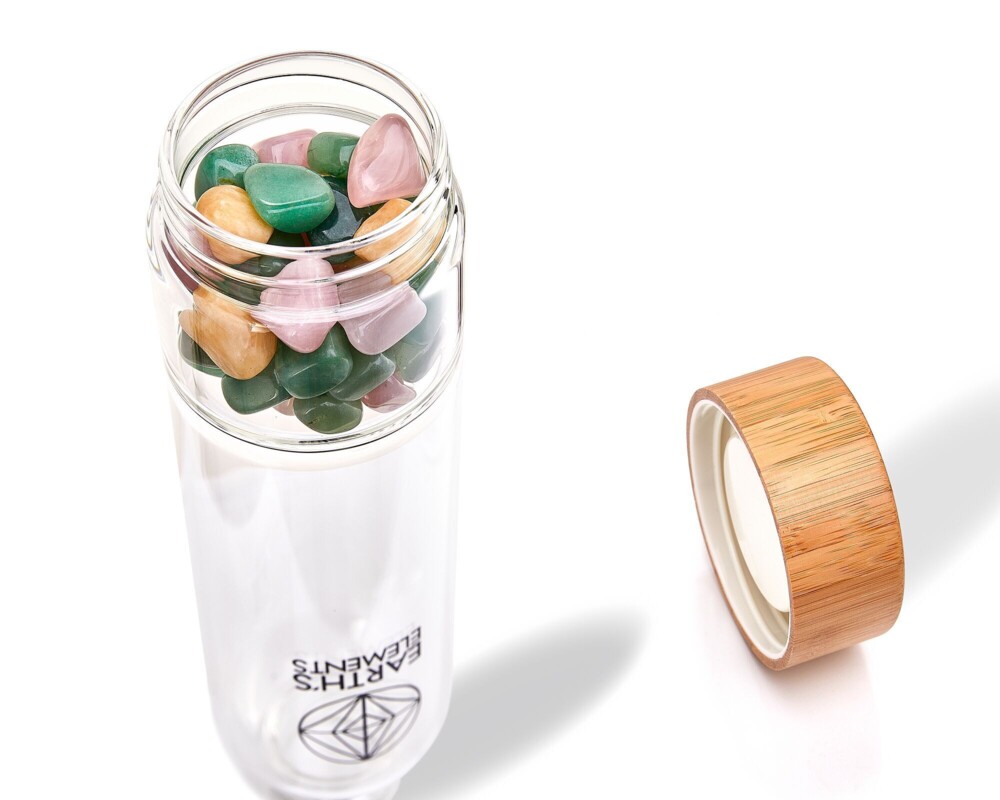 <font size="4"><span style="font-family: "EB Garamond";"><font size="4">Sacred Healing Crystal Water Bottle</font></span></font><div style="position: initial; margin: initial; font-family: "EB Garamond";"><p style="margin: initial; font-variant-numeric: normal; font-variant-east-asian: normal; font-stretch: normal; line-height: normal; font-family: "EB Garamond"; color: rgb(0, 0, 0); position: initial;"><font size="4"><br></font></p><p style="margin: initial; font-variant-numeric: normal; font-variant-east-asian: normal; font-stretch: normal; line-height: normal; font-family: "EB Garamond"; color: rgb(0, 0, 0); position: initial;"><font size="4">This bottle includes tumbled Honey Calcite, Green Aventurine, and Rose Quartz opening your heart and helping you receive abundance and radiance.</font></p><p style="margin: initial; font-variant-numeric: normal; font-variant-east-asian: normal; font-stretch: normal; line-height: normal; font-family: "EB Garamond"; color: rgb(0, 0, 0); position: initial;"><font size="4">We care about your health!</font></p><p style="margin: initial; font-variant-numeric: normal; font-variant-east-asian: normal; font-stretch: normal; line-height: normal; font-family: "EB Garamond"; color: rgb(0, 0, 0); position: initial;"><font size="4">With this beautiful and stylish gem glass bottle, you can help save the Earth.</font></p><p style="margin: initial; font-variant-numeric: normal; font-variant-east-asian: normal; font-stretch: normal; line-height: normal; font-family: "EB Garamond"; color: rgb(0, 0, 0); position: initial;"><font size="4">Plastic bottles are a health hazard and bad for the environment. We only utilize non-toxic materials with eco-friendly composition and exceptional craftsmanship.</font></p><p style="margin: initial; font-variant-numeric: normal; font-variant-east-asian: normal; font-stretch: normal; line-height: normal; font-family: "EB Garamond"; color: rgb(0, 0, 0); position: initial;"><font size="4">This bottle is the perfect reminder to drink your charged water daily! You can store any beverage without worrying about it changing in taste.</font></p><p style="margin: initial; font-variant-numeric: normal; font-variant-east-asian: normal; font-stretch: normal; line-height: normal; font-family: "EB Garamond"; color: rgb(0, 0, 0); position: initial;"><font size="4">This bottle is designed to raise your vibe and make you feel good.</font></p><p style="margin: initial; font-variant-numeric: normal; font-variant-east-asian: normal; font-stretch: normal; line-height: normal; font-family: "EB Garamond"; color: rgb(0, 0, 0); position: initial;"><font size="4">Our goal is to support your spiritual journey and to help connect one another through the gifts of our beautiful Earth.</font></p><p style="margin: initial; font-variant-numeric: normal; font-variant-east-asian: normal; font-stretch: normal; line-height: normal; font-family: "EB Garamond"; color: rgb(0, 0, 0); position: initial;"><font size="4">We feature a non-toxic airtight bamboo cup that will never leak.</font></p><p style="margin: initial; font-variant-numeric: normal; font-variant-east-asian: normal; font-stretch: normal; line-height: normal; font-family: "EB Garamond"; color: rgb(0, 0, 0); position: initial;"><font size="4">Of course, you need to be careful with your crystal bottle. Please do not force your crystals too tight because bottle divider can break. Handle with love and care.</font></p><p style="font-variant-numeric: normal; font-variant-east-asian: normal; font-stretch: normal; line-height: normal; font-family: "EB Garamond"; color: rgb(0, 0, 0); position: initial; margin: initial;"><font size="4">Your first set of crystals is included.</font></p></div> Sacred Healing Crystal Water Bottle
