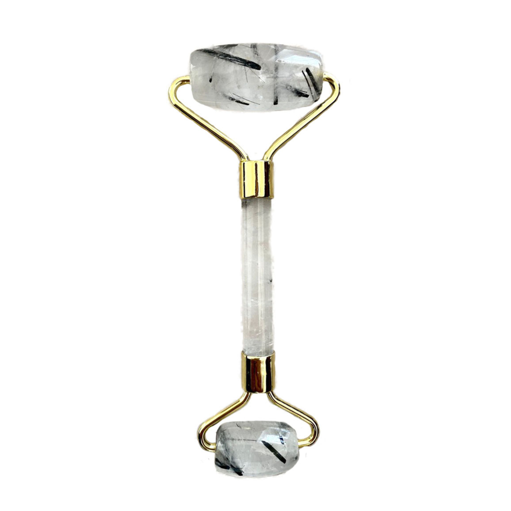 <font size="4" style="position: initial; margin: initial;"><span style="font-family: "EB Garamond"; position: initial; margin: initial;">Black Tourmaline In Quartz Facial Roller With Gold Hardware</span></font><div style="position: initial; margin: initial; font-family: "EB Garamond";"><font size="4" style="position: initial; margin: initial;"><br style="position: initial; margin: initial; font-family: "EB Garamond";"></font></div><div style="position: initial; margin: initial; font-family: "EB Garamond";"><p style="margin: initial; padding: 0px; border: 0px; font-variant-numeric: inherit; font-variant-east-asian: inherit; font-stretch: inherit; line-height: inherit; font-family: "EB Garamond"; vertical-align: baseline; color: rgb(51, 51, 51); position: initial;"><font size="4" style="position: initial; margin: initial;">Natural Black Tourmaline in Quartz face roller that assists lymphatic drainage to reduce the appearance of wrinkles, and puffiness. This roller acts as a massage tool for your face. You can use it alone or in conjunction with your skin care routine.</font></p><p style="margin: initial; padding: 0px; border: 0px; font-variant-numeric: inherit; font-variant-east-asian: inherit; font-stretch: inherit; line-height: inherit; font-family: "EB Garamond"; vertical-align: baseline; color: rgb(51, 51, 51); position: initial;"><span style="font-size: 16.8px; position: initial; margin: initial;">Black Tourmaline in Quartz</span><font size="4" style="position: initial; margin: initial;"> is a natural healing stone used to protect one against negativity and ease stress.</font></p><p style="margin: initial; padding: 0px; border: 0px; font-variant-numeric: inherit; font-variant-east-asian: inherit; font-stretch: inherit; line-height: inherit; font-family: "EB Garamond"; vertical-align: baseline; color: rgb(51, 51, 51); position: initial;"><font size="4" style="position: initial; margin: initial;">Face rollers are excellent in assisting with the following:</font></p><ul style="margin: initial; padding: 0px; border: 0px; font-variant-numeric: inherit; font-variant-east-asian: inherit; font-stretch: inherit; line-height: inherit; font-family: "EB Garamond"; vertical-align: baseline; color: rgb(51, 51, 51); position: initial;"><li style="margin: initial; padding: 0px; border: 0px; font-style: inherit; font-variant: inherit; font-weight: inherit; font-stretch: inherit; line-height: inherit; font-family: "EB Garamond"; vertical-align: baseline; list-style: outside disc; position: initial;"><font size="4" style="position: initial; margin: initial;">Helps fight wrinkles </font></li><li style="margin: initial; padding: 0px; border: 0px; font-style: inherit; font-variant: inherit; font-weight: inherit; font-stretch: inherit; line-height: inherit; font-family: "EB Garamond"; vertical-align: baseline; list-style: outside disc; position: initial;"><font size="4" style="position: initial; margin: initial;">Helps blood circulation to the face, and assists in detoxification </font></li><li style="margin: initial; padding: 0px; border: 0px; font-style: inherit; font-variant: inherit; font-weight: inherit; font-stretch: inherit; line-height: inherit; font-family: "EB Garamond"; vertical-align: baseline; list-style: outside disc; position: initial;"><font size="4" style="position: initial; margin: initial;">Decreases puffiness under eyes and around face</font></li><li style="margin: initial; padding: 0px; border: 0px; font-style: inherit; font-variant: inherit; font-weight: inherit; font-stretch: inherit; line-height: inherit; font-family: "EB Garamond"; vertical-align: baseline; list-style: outside disc; position: initial;"><font size="4" style="position: initial; margin: initial;">Brings a natural glow to your face</font></li><li style="margin: initial; padding: 0px; border: 0px; font-style: inherit; font-variant: inherit; font-weight: inherit; font-stretch: inherit; line-height: inherit; font-family: "EB Garamond"; vertical-align: baseline; list-style: outside disc; position: initial;"><font size="4" style="position: initial; margin: initial;">Helps tighten skin, making it appear more youthful</font></li><li style="margin: initial; padding: 0px; border: 0px; font-style: inherit; font-variant: inherit; font-weight: inherit; font-stretch: inherit; line-height: inherit; font-family: "EB Garamond"; vertical-align: baseline; list-style: outside disc; position: initial;"><font size="4" style="position: initial; margin: initial;">Helps absorb moisturizers and serums more fully</font></li></ul><p style="margin: initial; padding: 0px; border: 0px; font-variant-numeric: inherit; font-variant-east-asian: inherit; font-stretch: inherit; line-height: inherit; font-family: "EB Garamond"; vertical-align: baseline; color: rgb(51, 51, 51); position: initial;"><font size="4" style="position: initial; margin: initial;">As each stone is one of a kind and unique, please allow for variations in color and texture in the face roller that you receive versus the one photographed. Your satisfaction is 100% guaranteed or your money back.</font></p><p style="margin: initial; padding: 0px; border: 0px; font-variant-numeric: inherit; font-variant-east-asian: inherit; font-stretch: inherit; line-height: inherit; font-family: "EB Garamond"; vertical-align: baseline; color: rgb(51, 51, 51); position: initial;"><font size="4" style="position: initial; margin: initial;">Length: 6 inches.</font></p><p style="margin: initial; padding: 0px; border: 0px; font-variant-numeric: inherit; font-variant-east-asian: inherit; font-stretch: inherit; line-height: inherit; font-family: "EB Garamond"; vertical-align: baseline; color: rgb(51, 51, 51); position: initial;"><font size="4" style="position: initial; margin: initial;">Width: 2 inches.</font></p></div> Black Tourmaline In Quartz Facial Roller With Gold Hardware