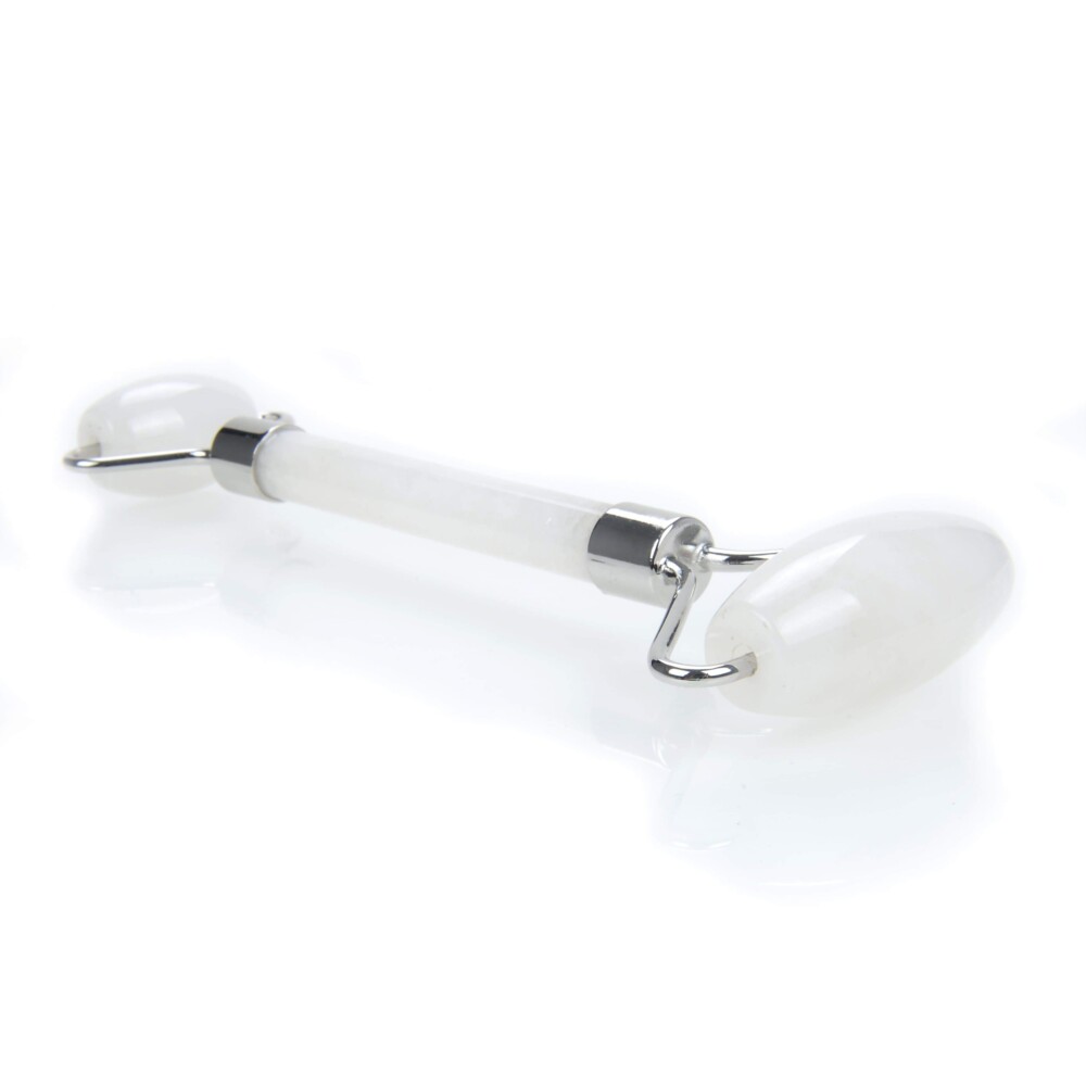<font size="4"><span style="font-family: "EB Garamond";">Quartz Crystal Facial Roller With Gold Hardware</span></font><div style="position: initial; margin: initial; font-family: "EB Garamond";"><font size="4"><br style="position: initial; margin: initial; font-family: "EB Garamond";"></font></div><div style="position: initial; margin: initial; font-family: "EB Garamond";"><p style="margin: initial; padding: 0px; border: 0px; font-variant-numeric: inherit; font-variant-east-asian: inherit; font-stretch: inherit; line-height: inherit; font-family: "EB Garamond"; vertical-align: baseline; color: rgb(51, 51, 51); position: initial;"><font size="4">Natural Quartz face roller that assists lymphatic drainage to reduce the appearance of wrinkles, and puffiness. This roller acts as a massage tool for your face. You can use it alone or in conjunction with your skin care routine.</font></p><p style="margin: initial; padding: 0px; border: 0px; font-variant-numeric: inherit; font-variant-east-asian: inherit; font-stretch: inherit; line-height: inherit; font-family: "EB Garamond"; vertical-align: baseline; color: rgb(51, 51, 51); position: initial;"><font size="4">Quartz is a stone believed to be an amplifier.</font></p><p style="margin: initial; padding: 0px; border: 0px; font-variant-numeric: inherit; font-variant-east-asian: inherit; font-stretch: inherit; line-height: inherit; font-family: "EB Garamond"; vertical-align: baseline; color: rgb(51, 51, 51); position: initial;"><font size="4">Face rollers are excellent in assisting with the following:</font></p><ul style="margin: initial; padding: 0px; border: 0px; font-variant-numeric: inherit; font-variant-east-asian: inherit; font-stretch: inherit; line-height: inherit; font-family: "EB Garamond"; vertical-align: baseline; color: rgb(51, 51, 51); position: initial;"><li style="margin: initial; padding: 0px; border: 0px; font-style: inherit; font-variant: inherit; font-weight: inherit; font-stretch: inherit; line-height: inherit; font-family: "EB Garamond"; vertical-align: baseline; list-style: outside disc; position: initial;"><font size="4">Helps fight wrinkles </font></li><li style="margin: initial; padding: 0px; border: 0px; font-style: inherit; font-variant: inherit; font-weight: inherit; font-stretch: inherit; line-height: inherit; font-family: "EB Garamond"; vertical-align: baseline; list-style: outside disc; position: initial;"><font size="4">Helps blood circulation to the face, and assists in detoxification </font></li><li style="margin: initial; padding: 0px; border: 0px; font-style: inherit; font-variant: inherit; font-weight: inherit; font-stretch: inherit; line-height: inherit; font-family: "EB Garamond"; vertical-align: baseline; list-style: outside disc; position: initial;"><font size="4">Decreases puffiness under eyes and around face</font></li><li style="margin: initial; padding: 0px; border: 0px; font-style: inherit; font-variant: inherit; font-weight: inherit; font-stretch: inherit; line-height: inherit; font-family: "EB Garamond"; vertical-align: baseline; list-style: outside disc; position: initial;"><font size="4">Brings a natural glow to your face</font></li><li style="margin: initial; padding: 0px; border: 0px; font-style: inherit; font-variant: inherit; font-weight: inherit; font-stretch: inherit; line-height: inherit; font-family: "EB Garamond"; vertical-align: baseline; list-style: outside disc; position: initial;"><font size="4">Helps tighten skin, making it appear more youthful</font></li><li style="margin: initial; padding: 0px; border: 0px; font-style: inherit; font-variant: inherit; font-weight: inherit; font-stretch: inherit; line-height: inherit; font-family: "EB Garamond"; vertical-align: baseline; list-style: outside disc; position: initial;"><font size="4">Helps absorb moisturizers and serums more fully</font></li></ul><p style="margin: initial; padding: 0px; border: 0px; font-variant-numeric: inherit; font-variant-east-asian: inherit; font-stretch: inherit; line-height: inherit; font-family: "EB Garamond"; vertical-align: baseline; color: rgb(51, 51, 51); position: initial;"><font size="4">As each stone is one of a kind and unique, please allow for variations in color and texture in the face roller that you receive versus the one photographed. Your satisfaction is 100% guaranteed or your money back.</font></p><p style="margin: initial; padding: 0px; border: 0px; font-variant-numeric: inherit; font-variant-east-asian: inherit; font-stretch: inherit; line-height: inherit; font-family: "EB Garamond"; vertical-align: baseline; color: rgb(51, 51, 51); position: initial;"><font size="4">Length: 6 inches.</font></p><p style="margin: initial; padding: 0px; border: 0px; font-variant-numeric: inherit; font-variant-east-asian: inherit; font-stretch: inherit; line-height: inherit; font-family: "EB Garamond"; vertical-align: baseline; color: rgb(51, 51, 51); position: initial;"><font size="4">Width: 2 inches.</font></p></div> Quartz Crystal Facial Roller With Gold Hardware