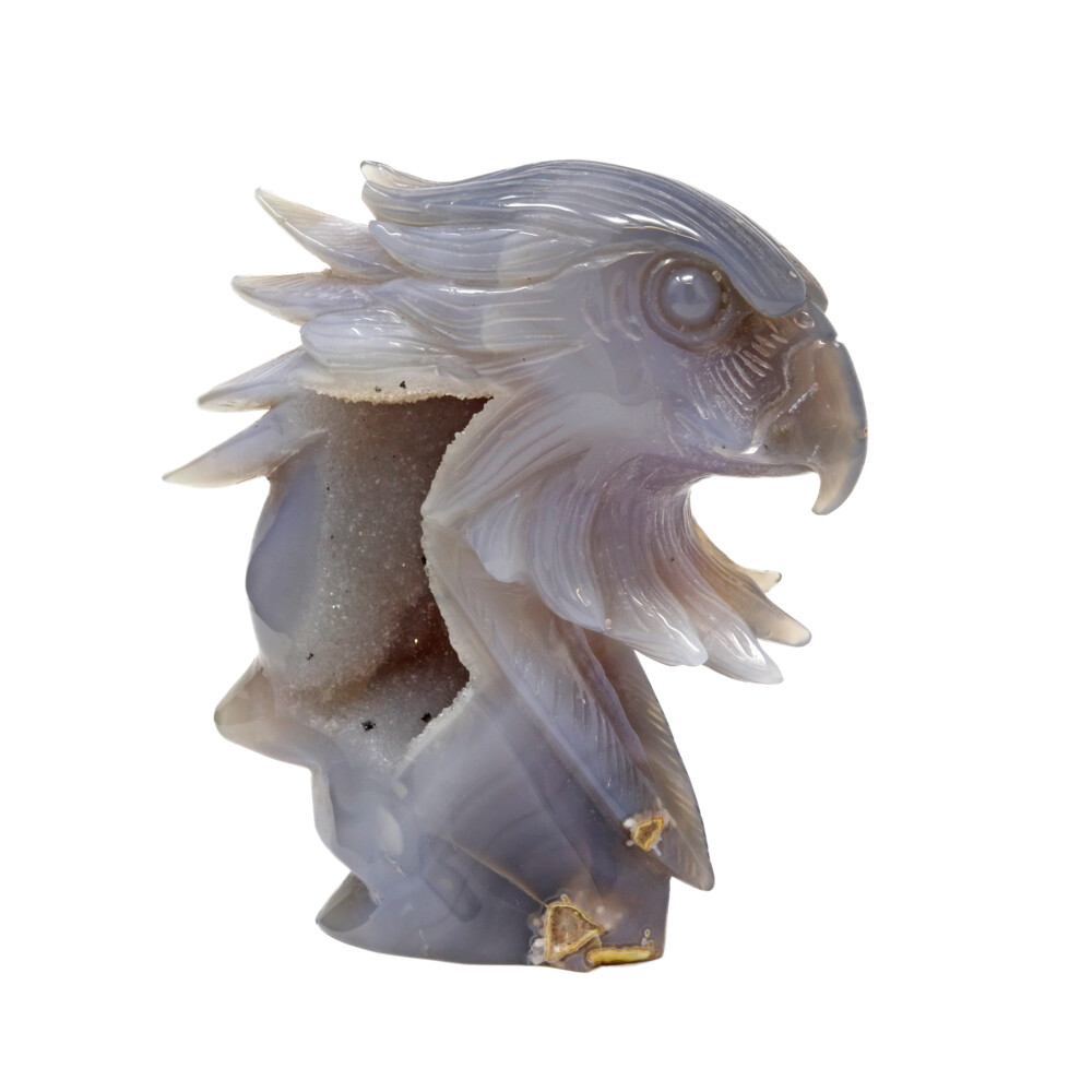 <span></span><span style="font-family: "EB Garamond";">The carving of this piece is spectacular! They took the time and attention to detail while carving this eagle head. Hand carved and polished out of a single piece of grey, blue and cream colored agate. There is a cream colored druze pocket on one side with black speckles. Druze is a formation of tiny crystals on the surface, or in the center of a larger crystal. This specimen will make a great conversation piece anywhere in your home or office. Agate Geodes are powerful crystals for good luck, protection and spiritual growth. Druze crystals have also been used to induce creativity and relaxation, as well as to help with emotional problems.</span> Druze Geode Agate Carving -Eagle Head