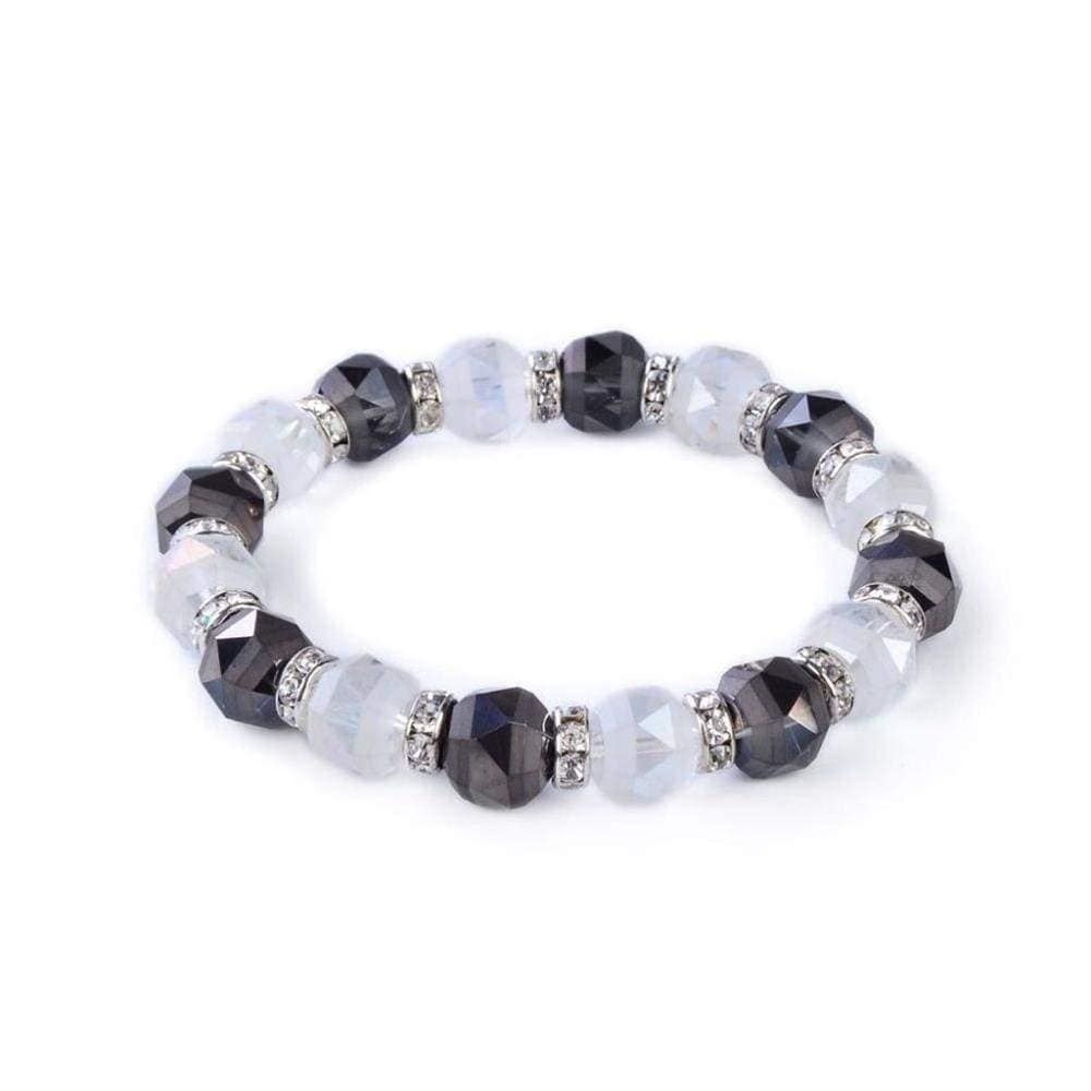 <font size="4" style="position: initial; margin: initial;"><span style="font-family: "EB Garamond"; position: initial; margin: initial;">Crystal Bracelet - Clear & Hematite </span></font><span style="font-family: "EB Garamond"; font-size: 16.8px; position: initial; margin: initial;">Color</span><div style="position: initial; margin: initial; font-family: "EB Garamond";"><font size="4" style="position: initial; margin: initial;"><br style="position: initial; margin: initial; font-family: "EB Garamond";"></font></div><div style="position: initial; margin: initial;"><p style="margin: initial; padding: 0px; border: 0px; font-variant-numeric: inherit; font-variant-east-asian: inherit; font-stretch: inherit; line-height: inherit; vertical-align: baseline; position: initial;"><font style="position: initial; margin: initial;"><font size="4" style="position: initial; margin: initial;">Each glass bead is faceted and sparkles as the light touches it. The beads are </font><font style="position: initial; margin: initial;"><span style="font-size: 16.8px; position: initial; margin: initial;">separated</span></font><font size="4" style="position: initial; margin: initial;"> by channel-set cubic zirconia crystals encased in rhodium plated spacers.</font></font></p><p style="margin: initial; padding: 0px; border: 0px; font-variant-numeric: inherit; font-variant-east-asian: inherit; font-stretch: inherit; line-height: inherit; vertical-align: baseline; position: initial;"><font style="position: initial; margin: initial;"><font size="4" style="position: initial; margin: initial;">This glass bracelet is perfect for a casual day with your friends, or a piece of </font><font style="position: initial; margin: initial;"><span style="font-size: 16.8px; position: initial; margin: initial;">jewelry</span></font><font size="4" style="position: initial; margin: initial;"> perfect for a formal event.</font></font></p><p style="font-family: "EB Garamond"; margin: initial; padding: 0px; border: 0px; font-variant-numeric: inherit; font-variant-east-asian: inherit; font-stretch: inherit; line-height: inherit; vertical-align: baseline; color: rgb(51, 51, 51); position: initial;"><font size="4" style="position: initial; margin: initial;">This bracelet is comfortable as it is secured by a strong elastic band that allows it to sit comfortably on most adult wrists and expand as needed.</font></p><p style="font-family: "EB Garamond"; margin: initial; padding: 0px; border: 0px; font-variant-numeric: inherit; font-variant-east-asian: inherit; font-stretch: inherit; line-height: inherit; vertical-align: baseline; color: rgb(51, 51, 51); position: initial;"><font size="4" style="position: initial; margin: initial;">Bracelet length - 8"</font></p></div> Crystal Bracelet - Clear & Hematite Color