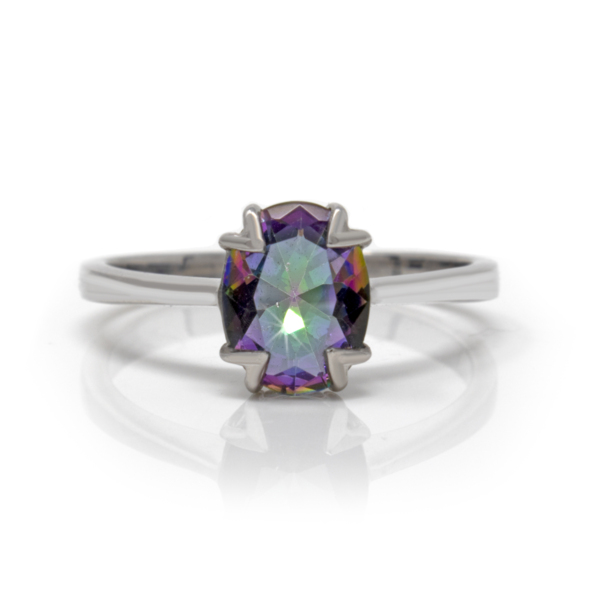 Closeup photo of Mystic Topaz Ring Size 5 - Faceted Prong Set Oval With Fancy Open Silver Prongs & Bezel Set On Silver Vert Band