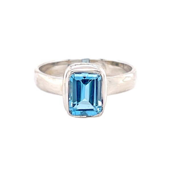 Closeup photo of Blue Topaz Ring Size 6 - Simple Emerald Cut Rectangle With Silver Bezel