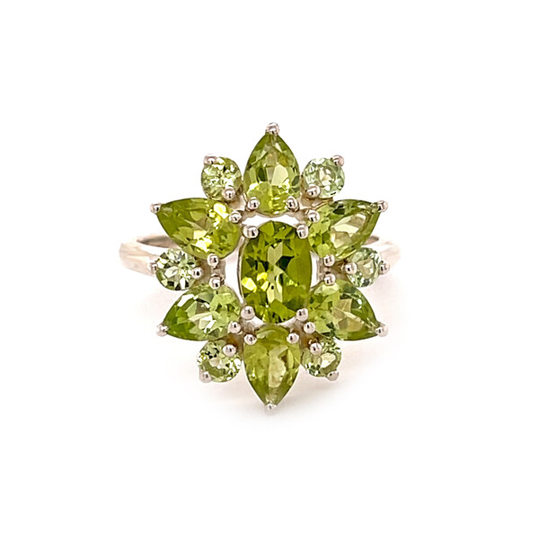 Closeup photo of Peridot Flower Ring Size 7 - Faceted Geometric Matrix Prong Set In Ornate Floral Shape