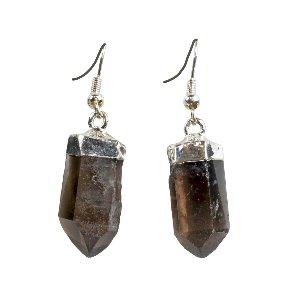 <font size="4"><span style="font-family: "EB Garamond";">Smoky Quartz Point Earrings - Silver Plated</span></font><div style="position: initial; margin: initial; font-family: "EB Garamond";"><p style="margin: initial; font-variant-numeric: normal; font-variant-east-asian: normal; font-stretch: normal; line-height: normal; font-family: "EB Garamond"; color: rgb(0, 0, 0); position: initial;"><font size="4">Each item is unique and one of a kind. Nature's treasures do vary in their shape and color.</font></p><div style="position: initial; margin: initial; font-family: "EB Garamond";"><font size="4"><br style="position: initial; margin: initial; font-family: "EB Garamond";"></font></div><div style="position: initial; margin: initial; font-family: "EB Garamond";"><span style="font-size: 1.2rem; color: rgb(0, 0, 0);">SMOKY QUARTZ</span><br></div><div style="position: initial; margin: initial; font-family: "EB Garamond";"><p style="margin: initial; font-variant-numeric: normal; font-variant-east-asian: normal; font-stretch: normal; line-height: normal; font-family: "EB Garamond"; color: rgb(0, 0, 0); position: initial;"><font size="4">“</font><span style="font-size: 1.2rem;">Gem of Transforming & Removing Negativity”</span></p><p style="margin: initial; font-variant-numeric: normal; font-variant-east-asian: normal; font-stretch: normal; line-height: normal; font-family: "EB Garamond"; color: rgb(0, 0, 0); position: initial;"><span style="position: initial; margin: initial; font-family: "EB Garamond";"><font size="4">Smoky Quartz </font></span><span style="font-size: 1.2rem;">is a translucent variety of quartz; with colors ranging</span></p><p style="margin: initial; font-variant-numeric: normal; font-variant-east-asian: normal; font-stretch: normal; line-height: normal; font-family: "EB Garamond"; color: rgb(0, 0, 0); position: initial;"><font size="4">from a translucent brownish-gray to an almost opaque black (Morion).</font></p><p style="margin: initial; font-variant-numeric: normal; font-variant-east-asian: normal; font-stretch: normal; line-height: normal; font-family: "EB Garamond"; color: rgb(0, 0, 0); position: initial;"><font size="4">The color occurs due to its chemical composition as a silicon dioxide</font></p><p style="margin: initial; font-variant-numeric: normal; font-variant-east-asian: normal; font-stretch: normal; line-height: normal; font-family: "EB Garamond"; color: rgb(0, 0, 0); position: initial;"><font size="4">mineral; when free silicon atoms are exposed to natural irradiation.</font></p><p style="margin: initial; font-variant-numeric: normal; font-variant-east-asian: normal; font-stretch: normal; line-height: normal; font-family: "EB Garamond"; color: rgb(0, 0, 0); position: initial;"><font size="4">Energetically smoky quartz is a great protection stone on many levels. As </font><span style="font-size: 1.2rem;">a transformative stone, it is excellent at elevating moods, relieving stress </span><span style="font-size: 1.2rem;">and other negative emotions. It is also very grounding and physically it </span><span style="font-size: 1.2rem;">may help ease dis-eases occurring around the lower torso. Associated </span><span style="font-size: 1.2rem;">with the Root Chakra.</span></p></div></div> Smoky Quartz Point Earrings - Silver Plated