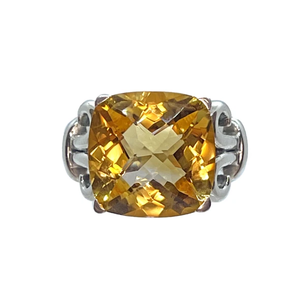 Closeup photo of Faceted Citrine Ring Size 9 - Square With Radiant Facets Prong Set On Ornate Cut Out Raised Bezel & Silver Filigree Detail On Band Top