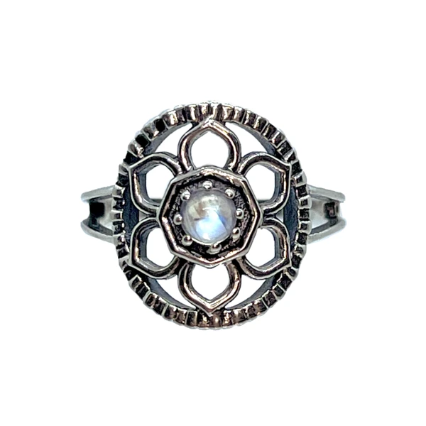 Closeup photo of Moonstone Flower Ring Size 7 - Round Cabochon With Silver Flower Petals & Stamped Silver Circle Set On Open Silver Bezel