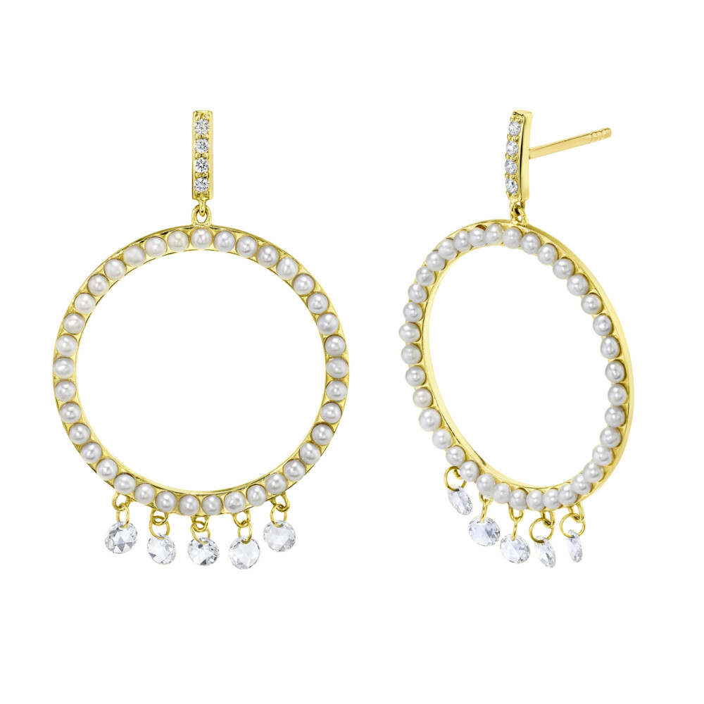 SLOANE STREET OPEN CIRCLE CHANDELIER EARRING IS A PLAYFUL PEARL EARRING WITH FIVE HANGING MICRO-DRILLED ROSECUT DIAMONDS IN 18K YELLOW GOLD, CREATING MOVEMENT AND SPARKLE WITH EVERY STEP. THIS EARRING IS EASY ENOUGH TO WEAR IN A CASUAL SETTING BUT TAILORED ENOUGH TO WEAR IN THE BOARD ROOM. Open Seed Pearl Earrings With Dangling Rosecut Diamonds