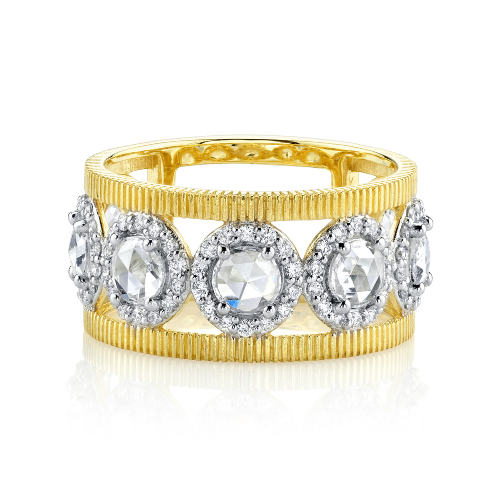 <span style="font-size: 16.8px; position: initial; margin: initial;">SLOANE STREET ROSE-CUT DIAMOND BAND RING IN 18K YELLOW GOLD FEATURES ROUND ROSE-CUT WHITE DIAMONDS WITH PAVE DIAMOND HALOS AROUND EACH STONE SET OFF BY RICH SIGNATURE STRIE TEXTURED GOLD SIDES, CREATING FEMININE AIR SPACES FOR A CHARMING AND UNIQUE TWO-TONE LOOK. THIS PIECE HAS JUST THE RIGHT AMOUNT OF SPARKLE TO TAKE YOUR LOOK FROM DAY TO NIGHT.</span> Rosecut Diamond Band