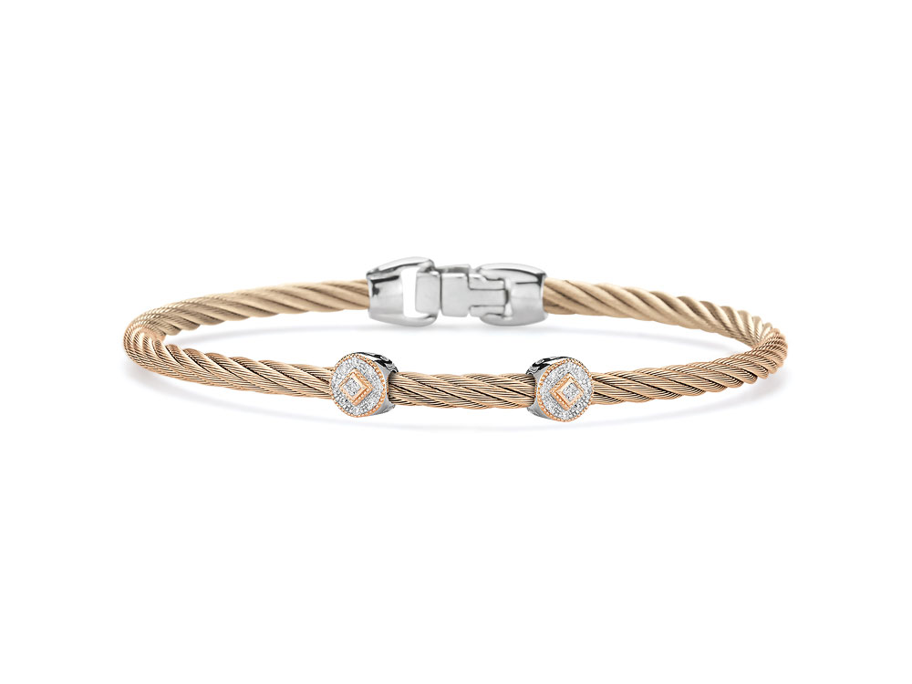 This carnation colored heat treated cable displays two circle 18k white gold with rose gold diamond stations; displaying a total carat weight of .09cts. This bracelet is perfect to stack with other's from this collection: or to just wear alone. Carnation Two Circled Station Bangle
