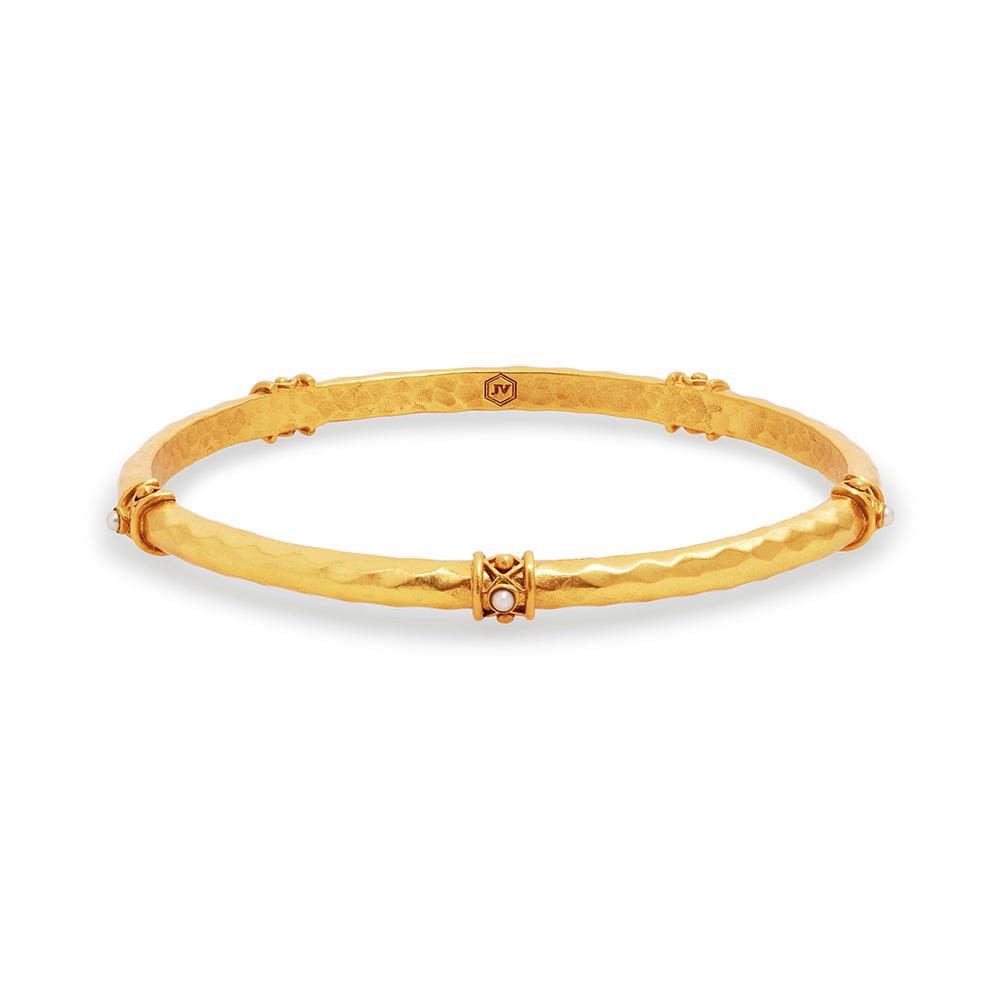 Savannah Bangle Gold Pearl station bracelet, with 5 pearl stations. 24k gold plate this is perfect to add to any outfit! Savannah Bangle