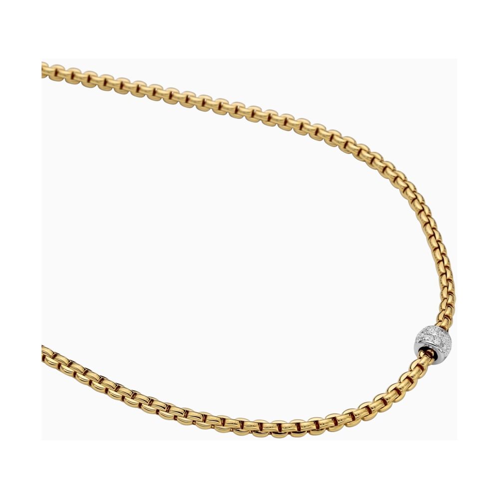 This 18k yellow gold necklace displays a single round gold and diamond pavé pendant. With a total diamond weight of .19 carats, this necklace is perfect for everyday use. Gorgeous italian gold, makes this necklace something easily dressed up for an evening out. EKA Tiny Necklace with Diamond Pavé