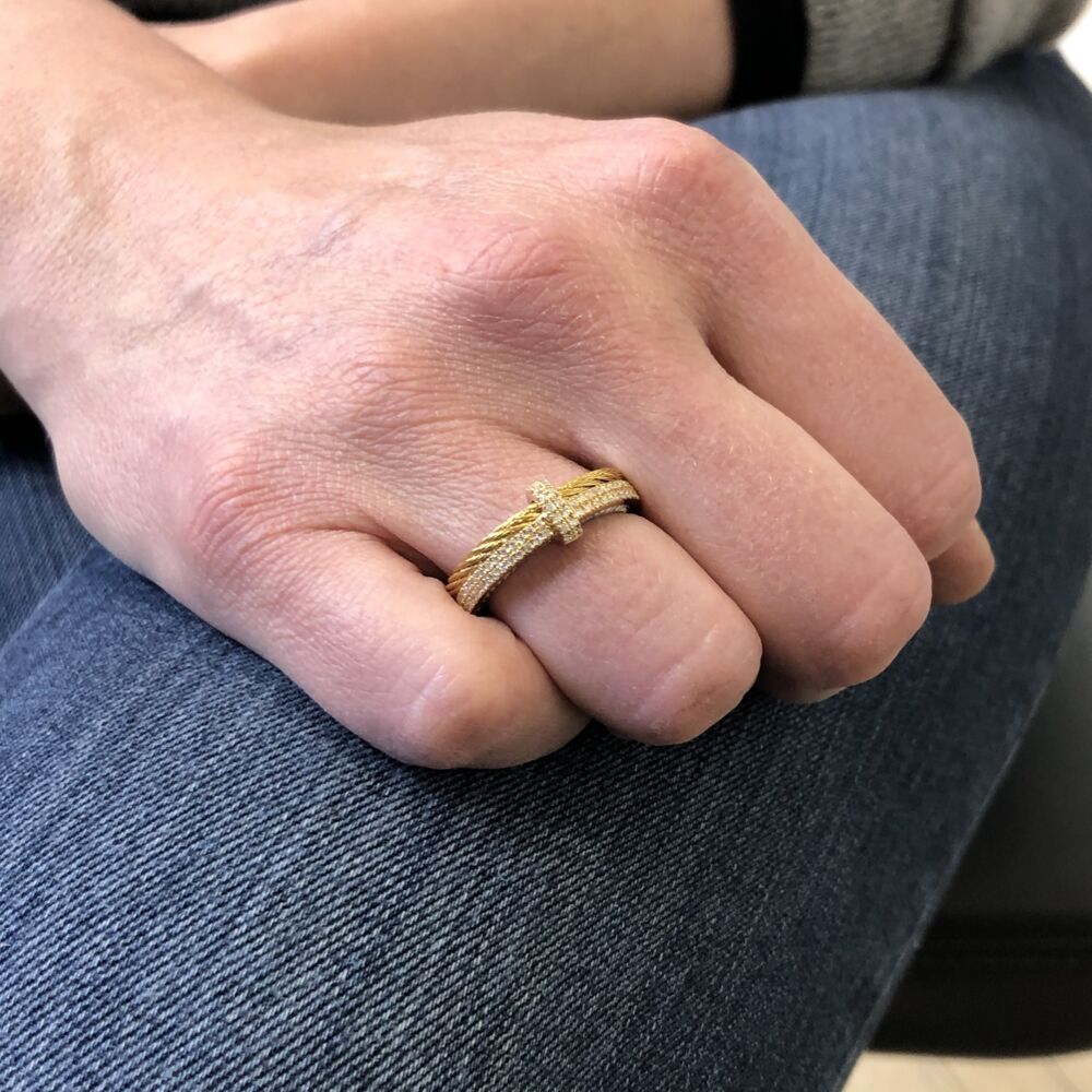This heat treated yellow colored steel cable features a single strand of cable connected with a band of 18k yellow gold, displaying two rows of set diamonds. Across the top of both bands features and 18k yellow gold setting bar, displaying its own two rows of set diamonds. A total diamond carat weight of .33 carats gives this ring a unique and modern feel. Yellow & Yellow Gold Ring