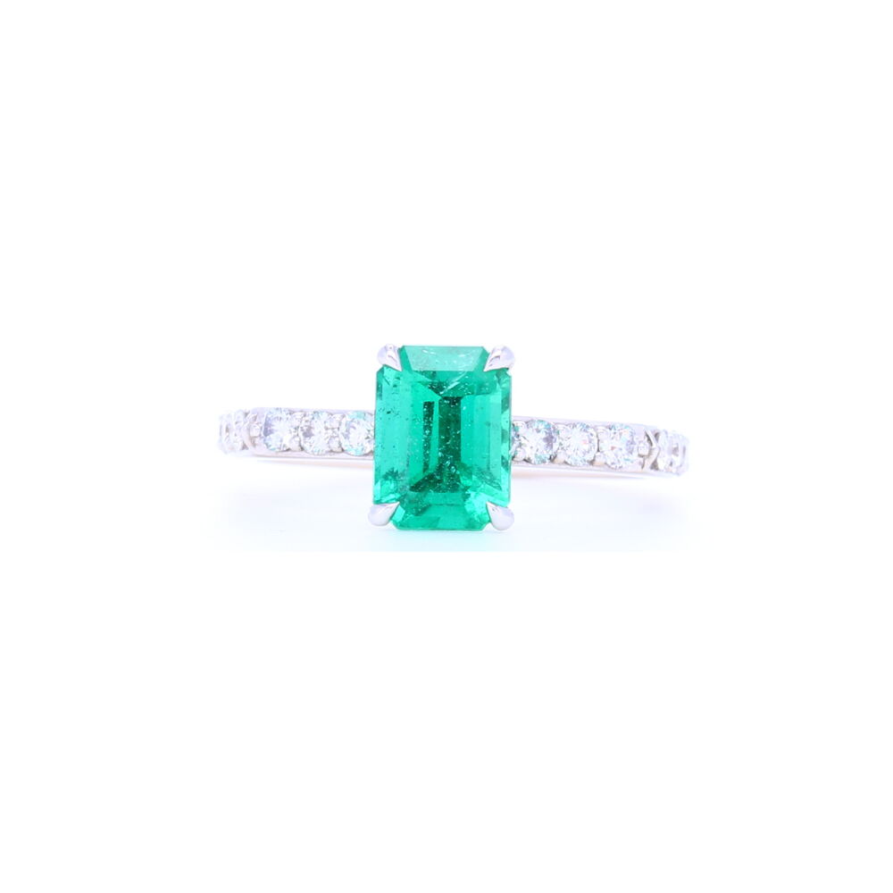 This elegant Certified 1.37 carat Zambian emerald is set in 18k white gold with .55 carats of prong set brilliant cut diamonds down the shank. Handcrafted in Italy this setting feels smooth as silk and substantial in weight. This will fit perfect with any of our stack rings since the emerald sits up high enough. 18k White GoldZambian Emerald Solitaire with Pave Diamond Shank