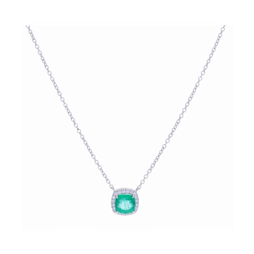 This .7 carat cushion cut Zambian Emerald pendant necklace is accented with .1 carats of brilliant cut diamonds, set in a beautiful halo. Celebrate a May birthday for yourself or a loved one. This necklace is a perfect layering piece, feminine yet substantial. Halo Set Cushion Zambian Emerald Pendant Necklace