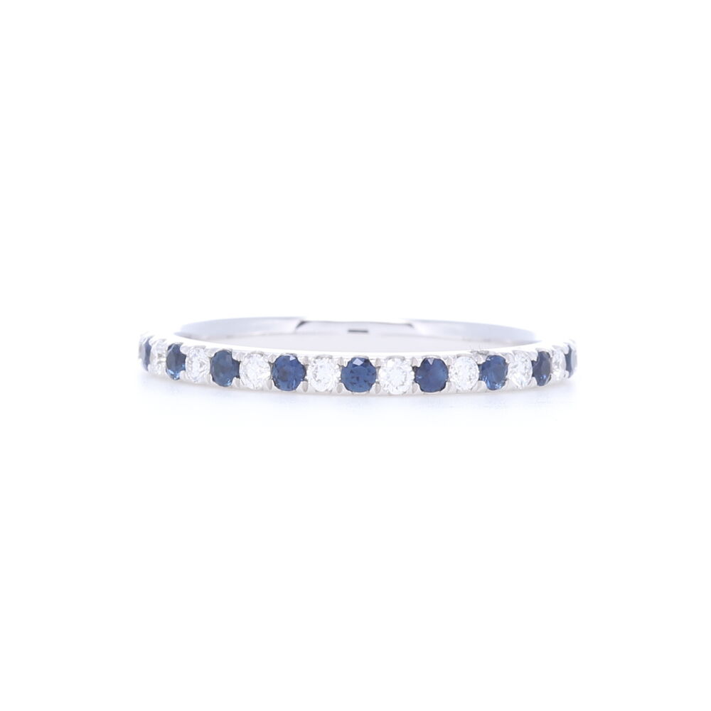 This 14k white gold round cut diamond and sapphire shared prong stack ring is a nice way to add a touch of color to any ring stack. With .27 carats of diamonds and .33 carats of sapphire, this is a great way to symbolize a September birth date for yourself or family. Round Cut Diamond and Sapphire Alternating Stack Ring