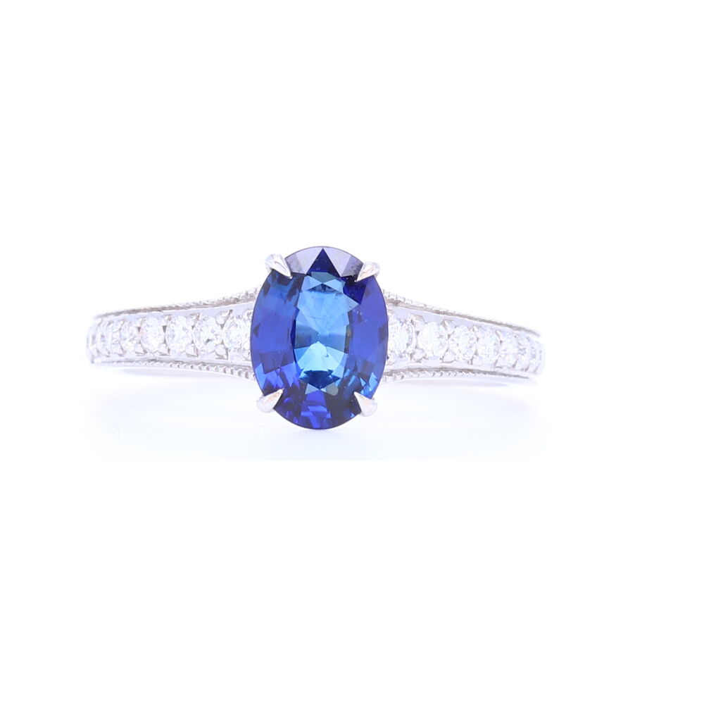 Sir Lankan blue oval sapphire is set in a timeless setting with pave down the shank - 18k white gold, .28 carats of diamonds and 1.25 carat blue sapphire. Vivid Blue Oval Sapphire Solitaire with Pave Diamond Shank