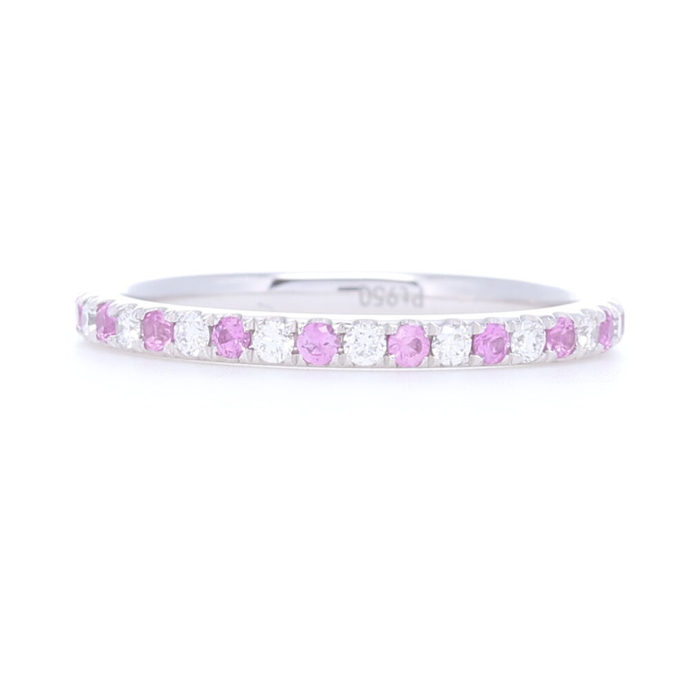 0.37 carats of pink sapphires and 0.28 carats of diamonds set into platinum make this a rare size ring to have in stock. Beautiful stones set into this lovely channel set platinum band make for a stunning pop of color for any stack ring set or engagement ring. Platinum Alternating Pink Sapphire and Diamond Stack Eternity Ring