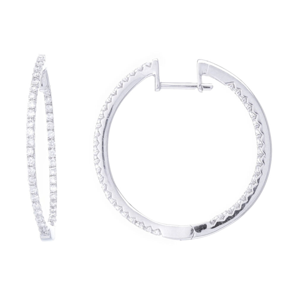 These 1'' round inside outside hoop earrings contain .5 carats of diamonds and are set into 14k white gold. Prong set brilliant cut white diamonds and a size that's easy to wear, these will soon be a favorite. 14k White Gold Round Diamond Round Shaped In & Out Hoop Earrings