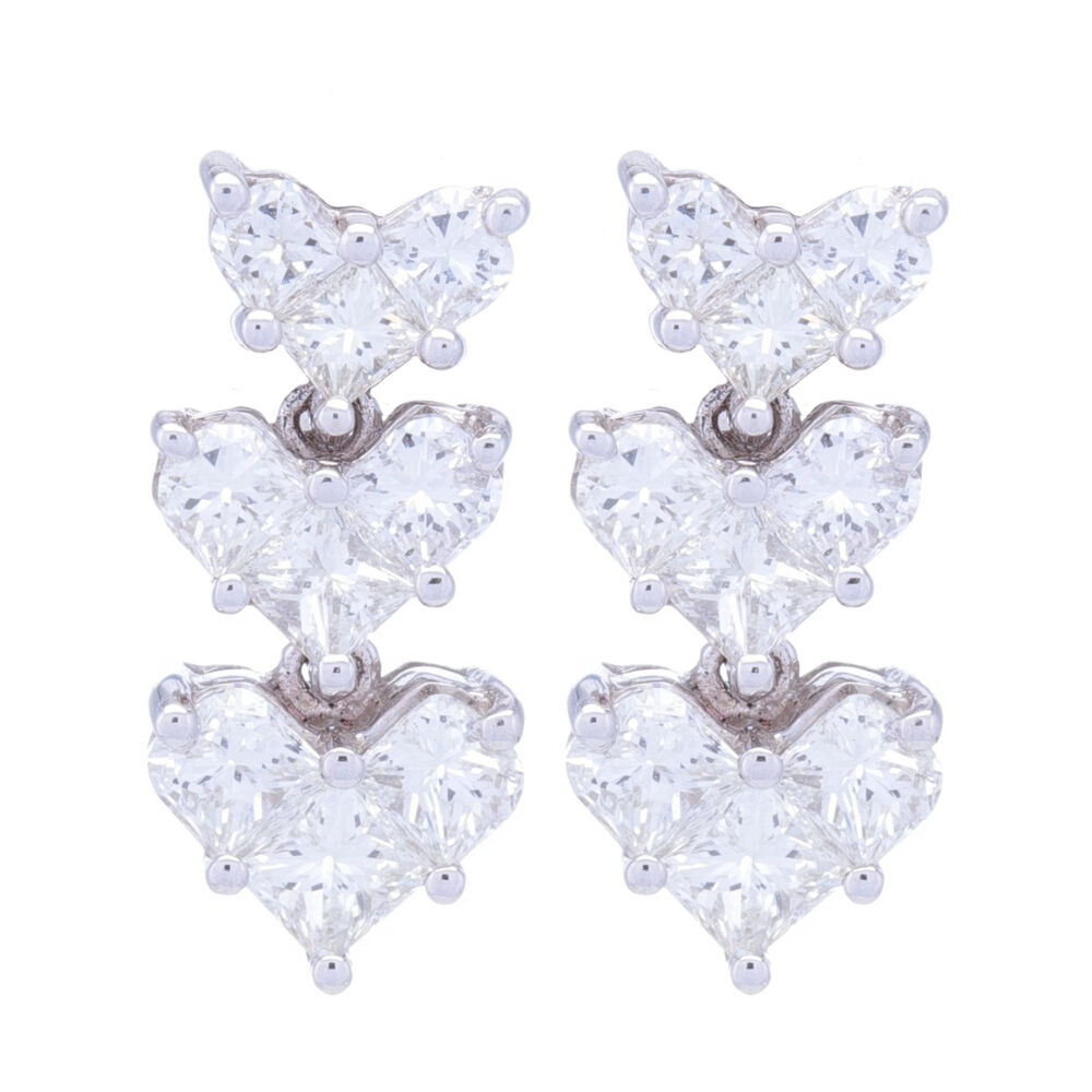 Heart shaped diamond dangle drop clusters earrings are easy to wear, elegant and they have 1.49 total carat weight. Post back and sent in 14k white gold, these are a staple of an earring collection. 18k White Gold Heart Shape Drop Earrings