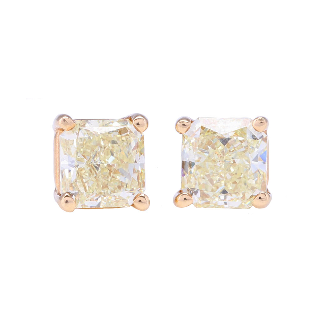 These princess cut yellow diamond stud earrings have 1.56 total carat weight. Set in 14k yellow gold to accentuate the color of the diamonds. For the girl who loves yellow - these deliver. Princess Cut Yellow Diamond Studs 1.56 tcw